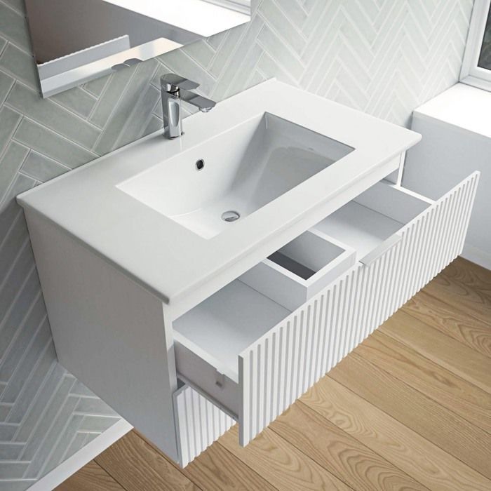 Mueble de baño con lavabo individual de 60 cm, fabricado en MDF corrugado blanco.