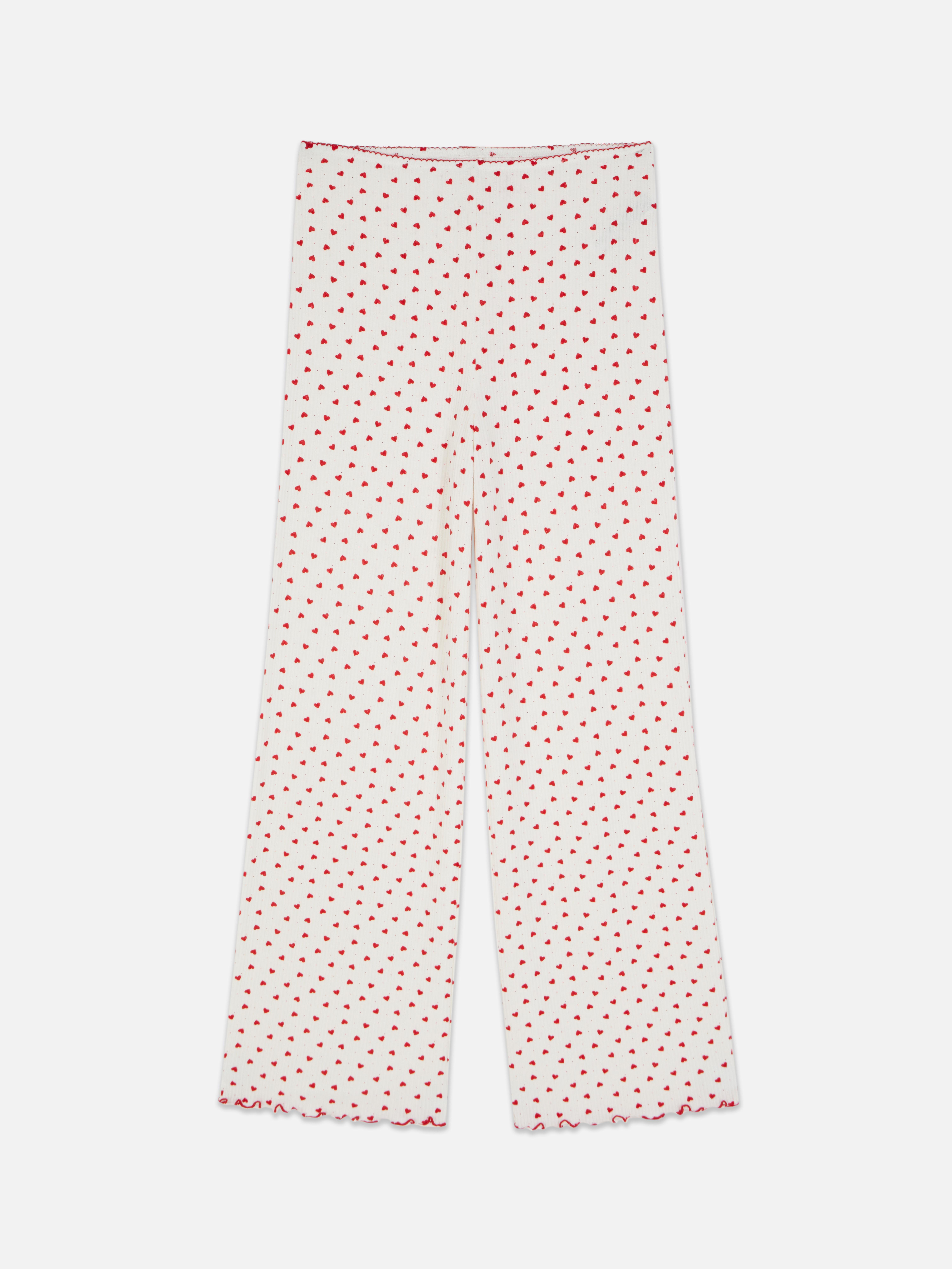 Pantaloni de pijama cu model cu inimă. Pantaloni de pijama moi cu nervuri, cu talie elastică, tiv festonat și model.