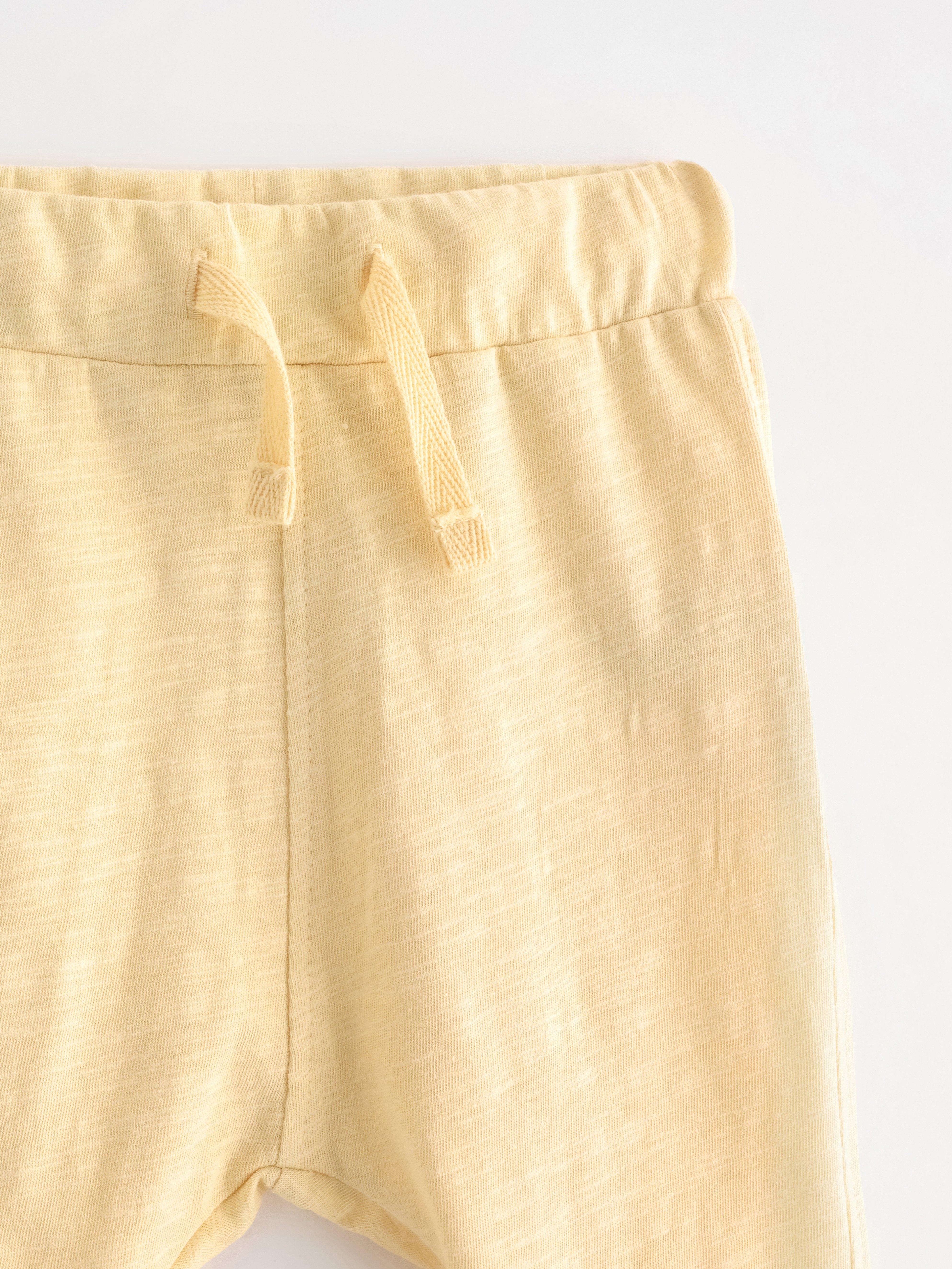 Mjukisbyxor i slubtrikå Amarillo polvoriento claro