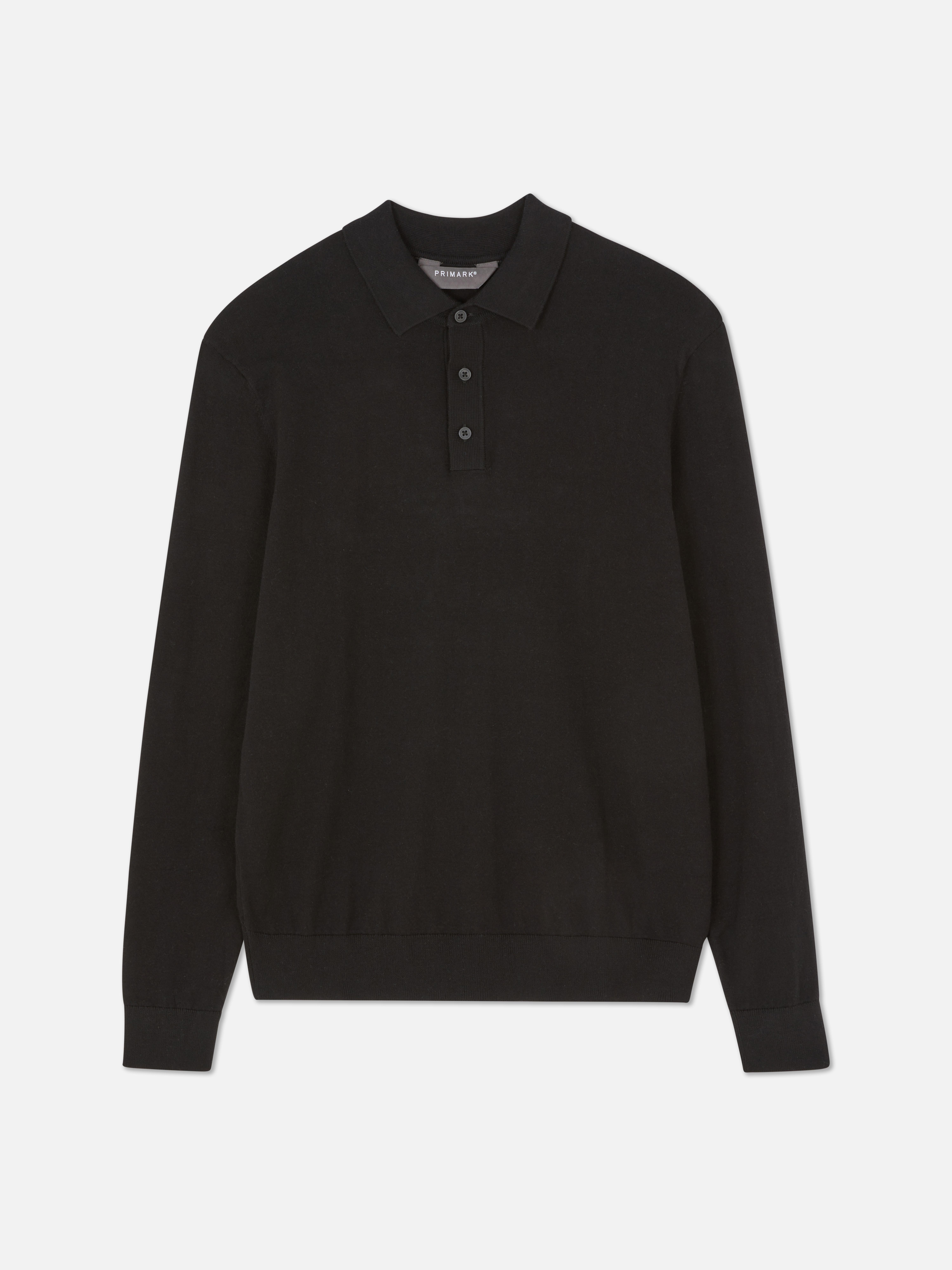 Pulover cu mânecă lungă. Acest tricou polo tricotat are guler, fentă cu nasturi și mâneci lungi.