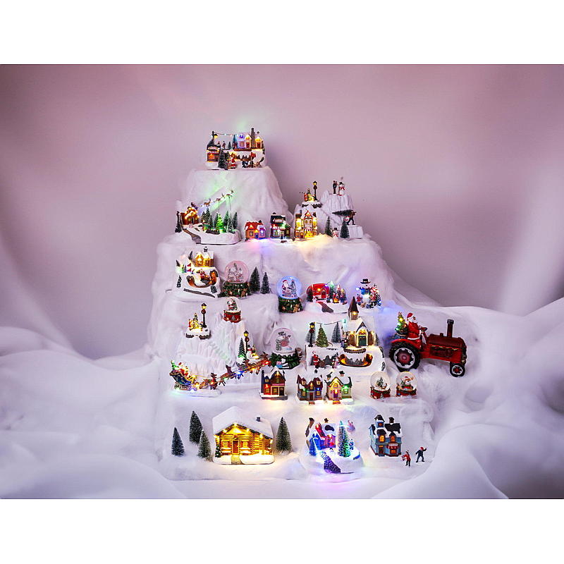 Kotijoulukylä valaistuilla mökeillä