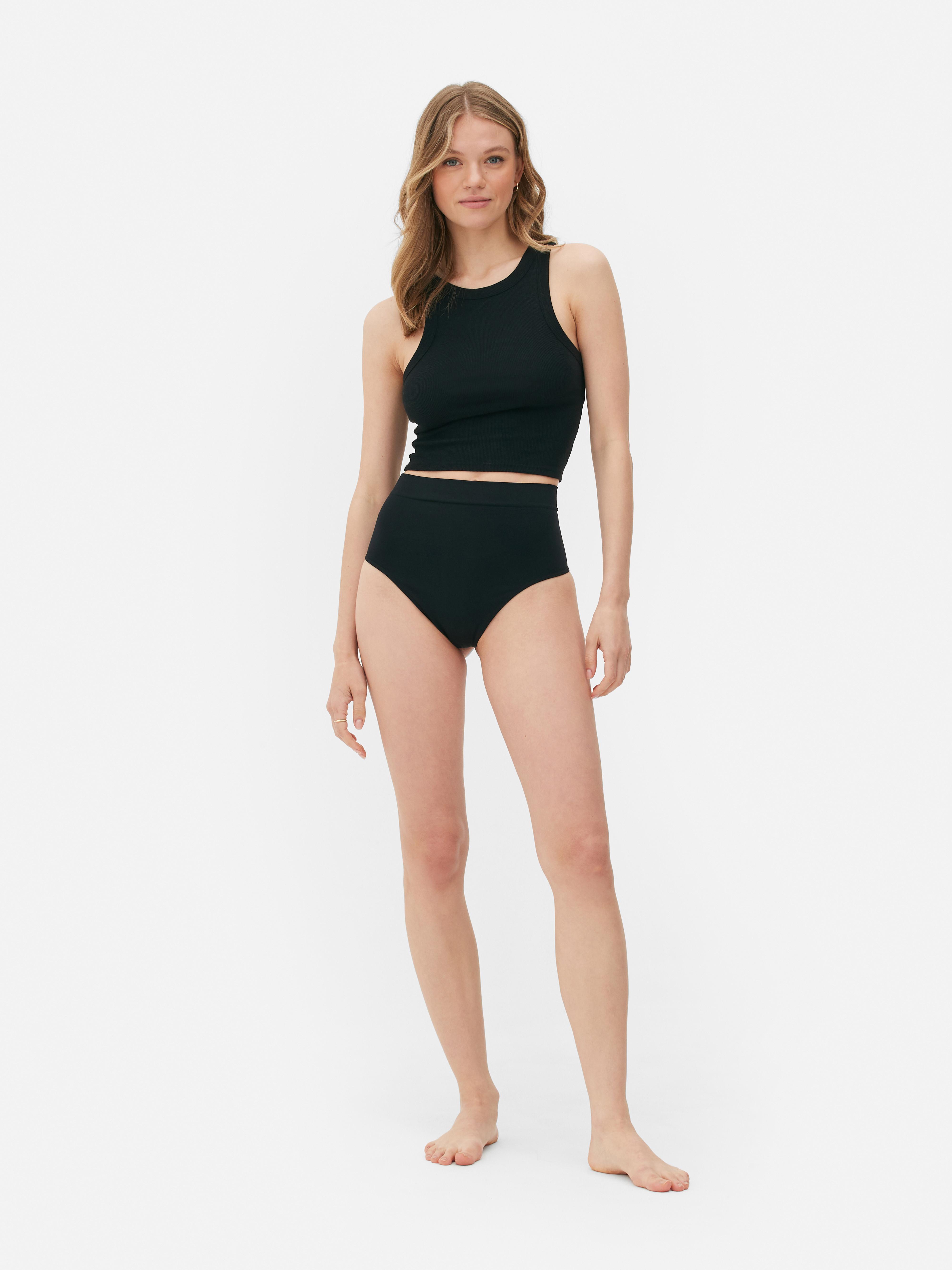 Tanga modelatoare cu talie înaltă, fără cusături Un tanga modelator cu talie înaltă pentru o siluetă elegantă