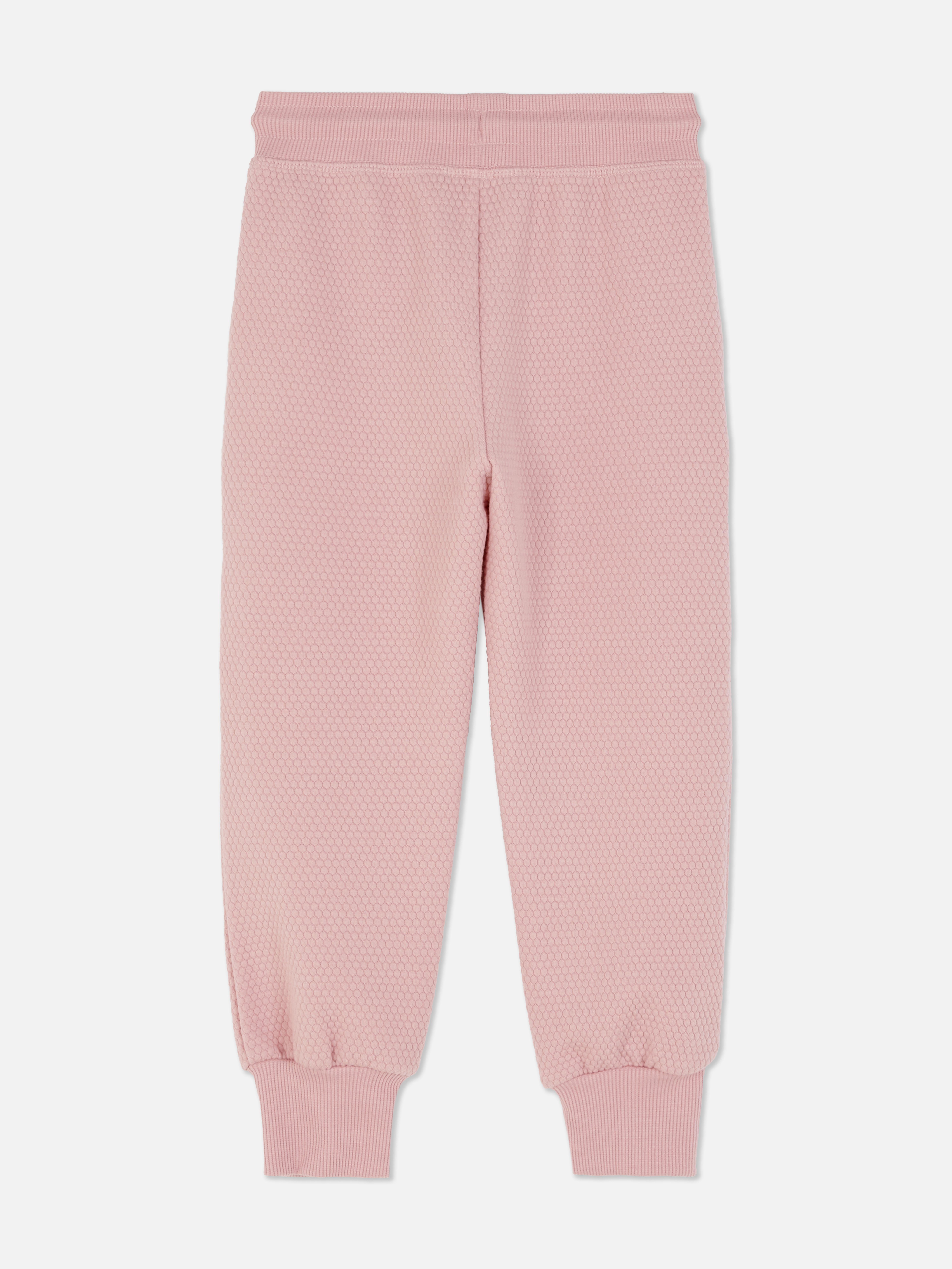 Matchende joggingbroek met trekkoord en wafeltextuur Een joggingbroek van wafelstof met trekkoord, steekzakken en enkelboorden
