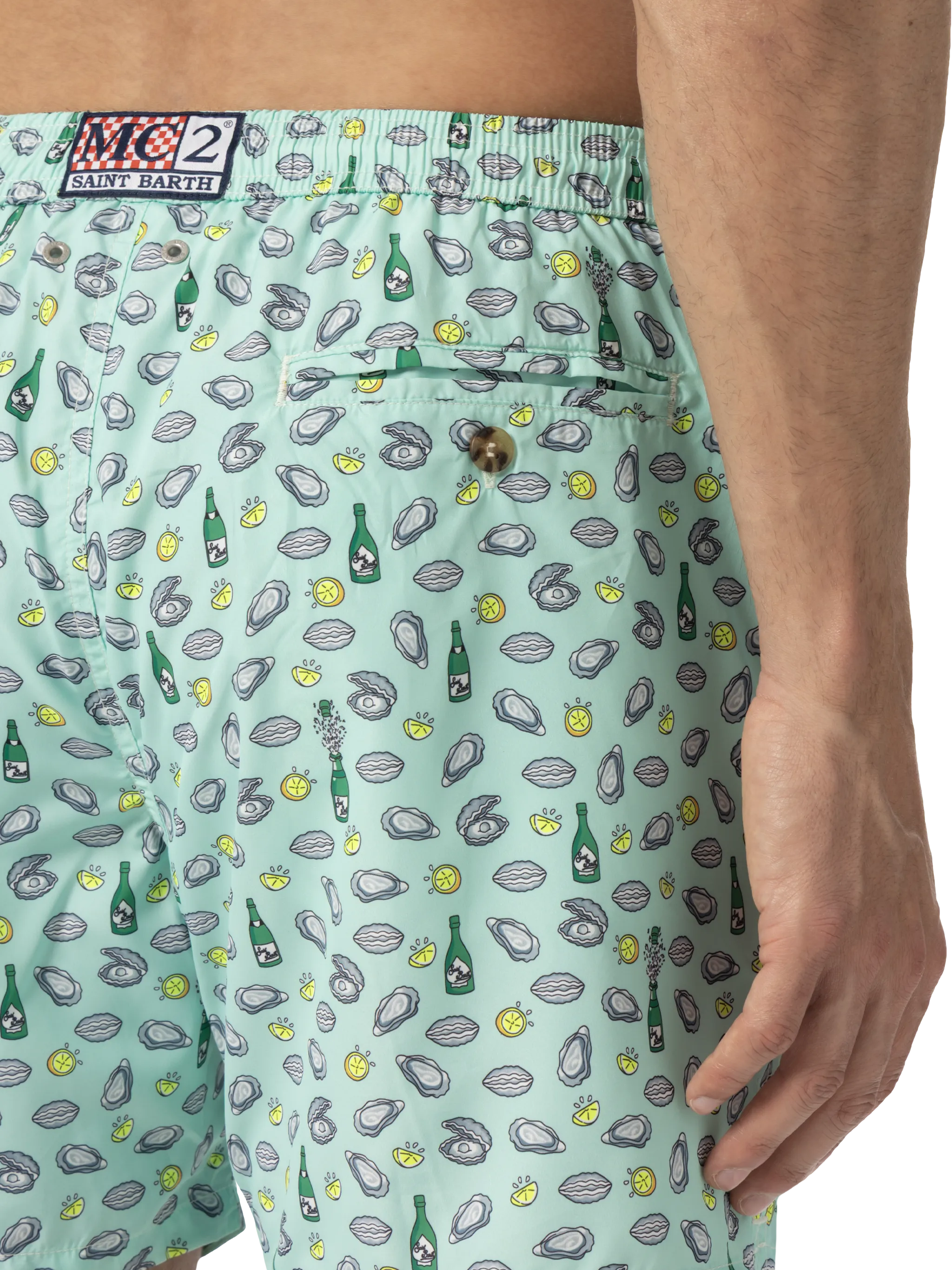 Zwempak met een luchtige uitstraling, gemaakt van lichtgewicht stof met een print van oesters en flessen.