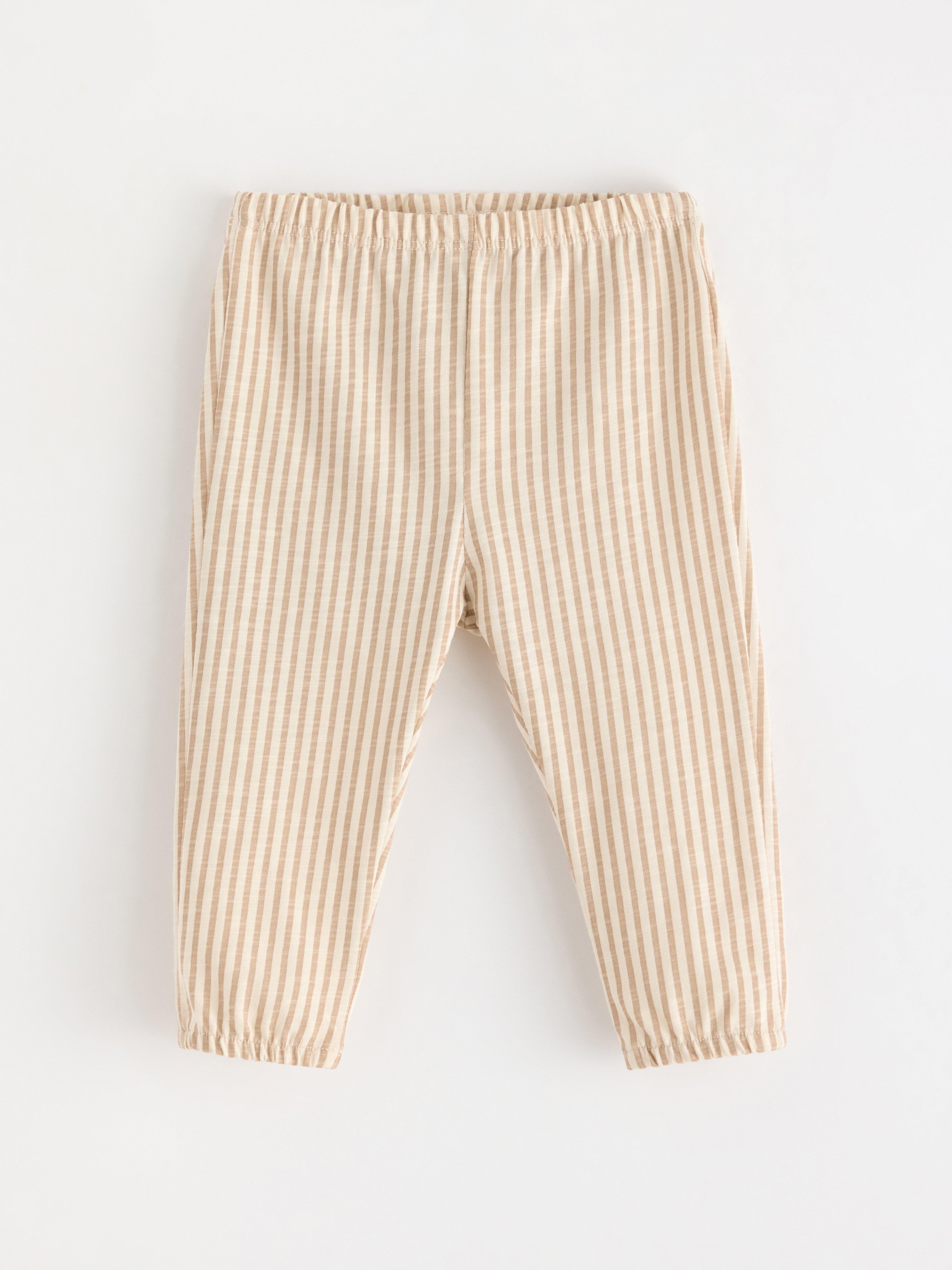 Pantalones de punto color beige
