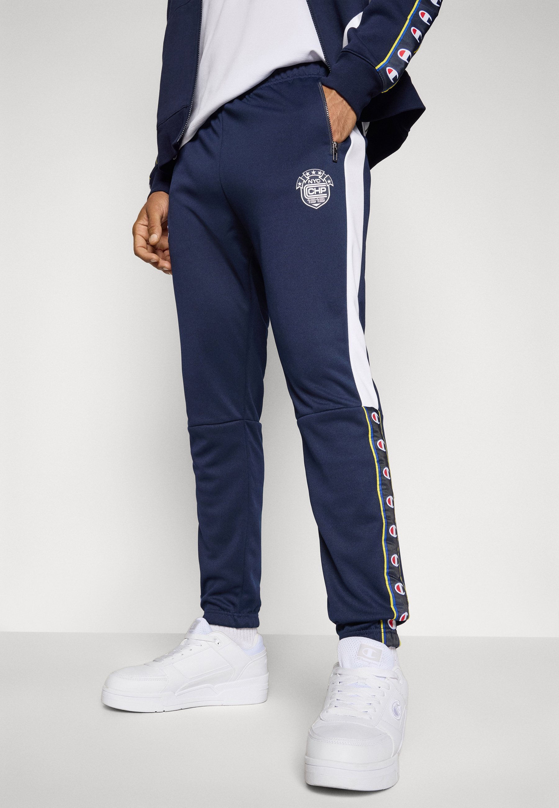 Pantalon de survêtement Champion SPORT HERITAGE à poignets élastiques - Bleu foncé