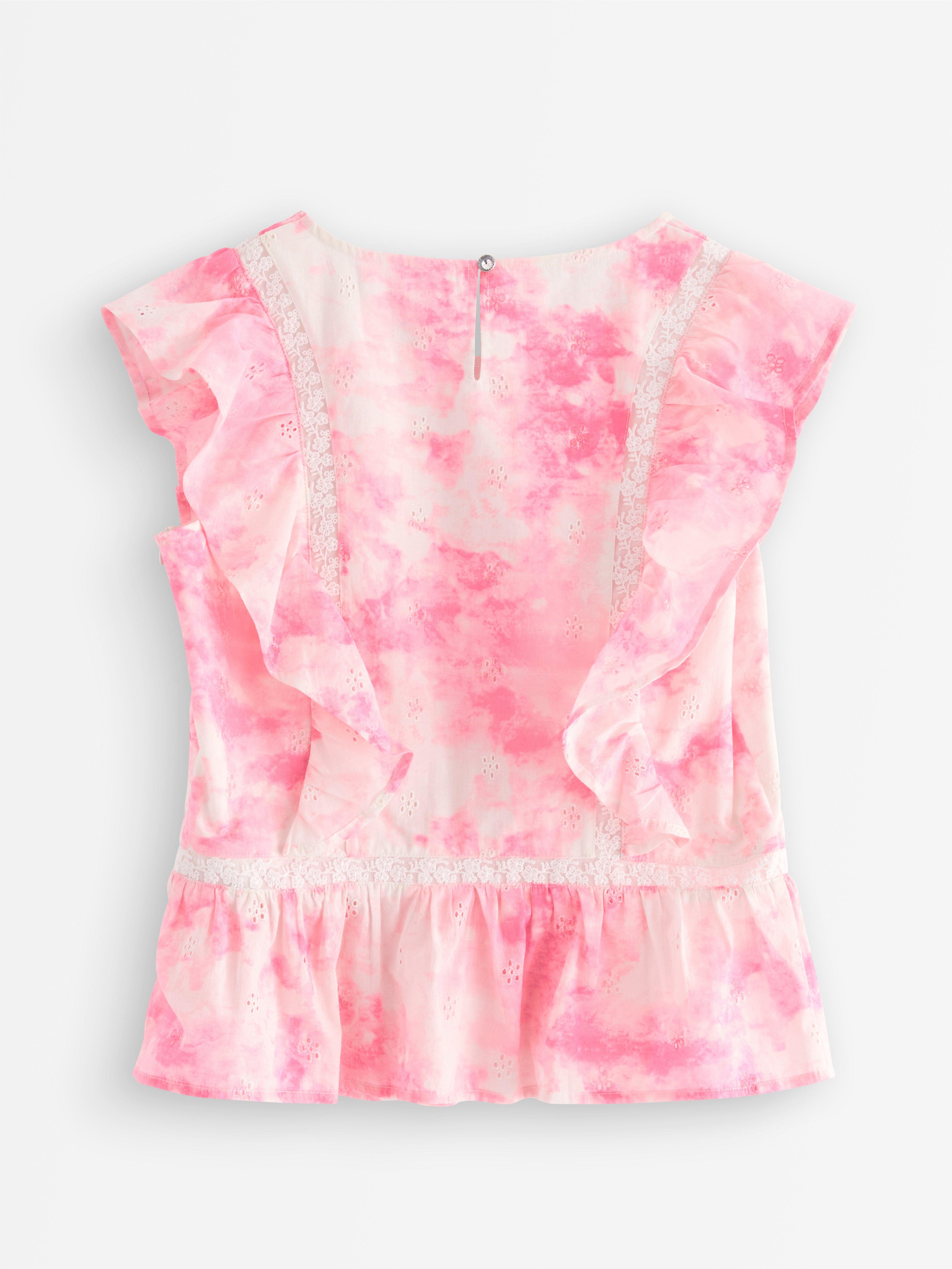 Blusa con volantes rosa claro
