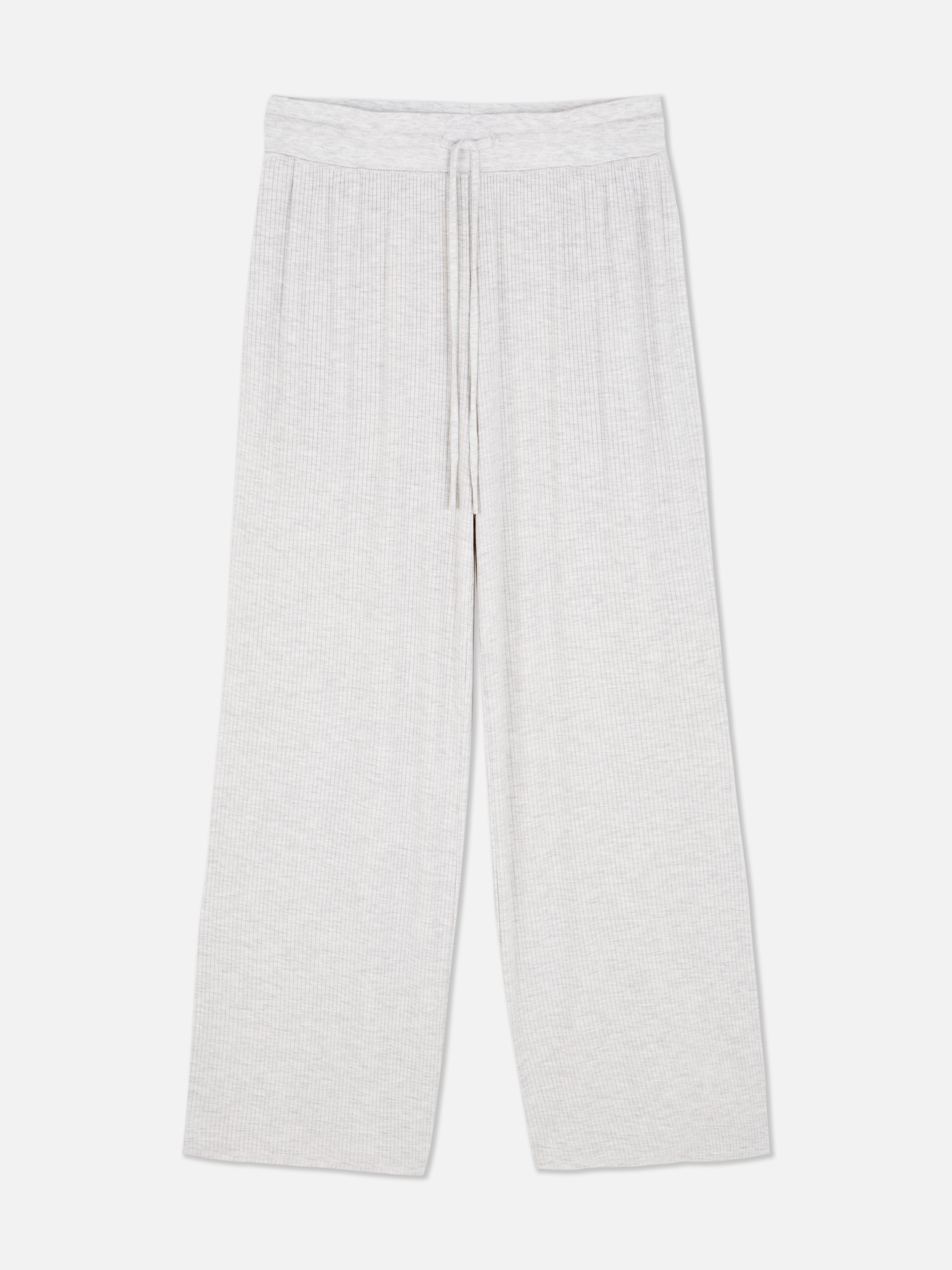 Gerippte Pyjamahose mit weitem Bein. Stilvolle Loungewear-Hose mit weitem Bein, Kordelzug und drapiertem Design.