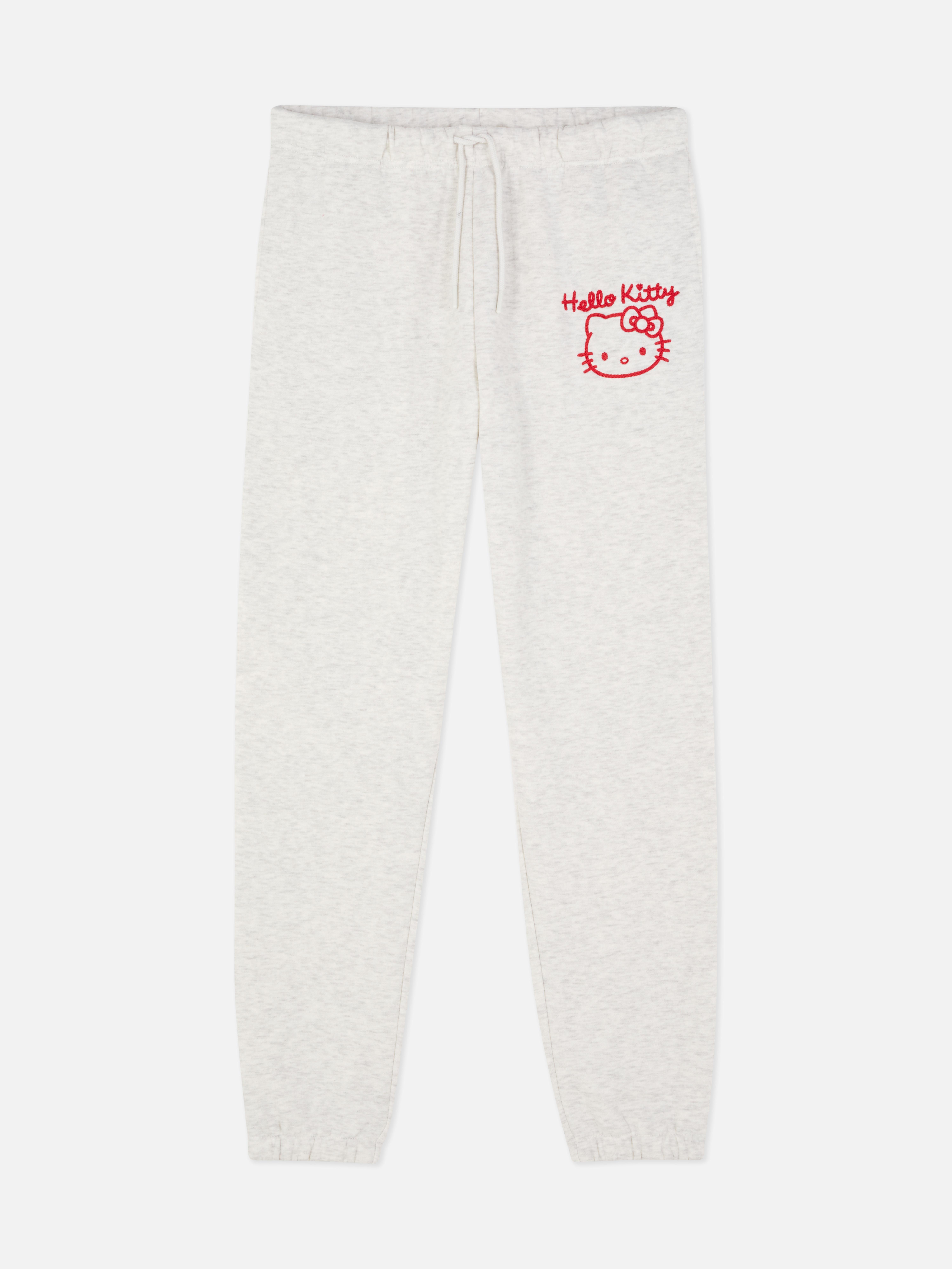 Pantaloni de jogging cu imprimeu Hello Kitty. Un pantalon de jogging Hello Kitty cu șnur în talie și manșete la gleznă.