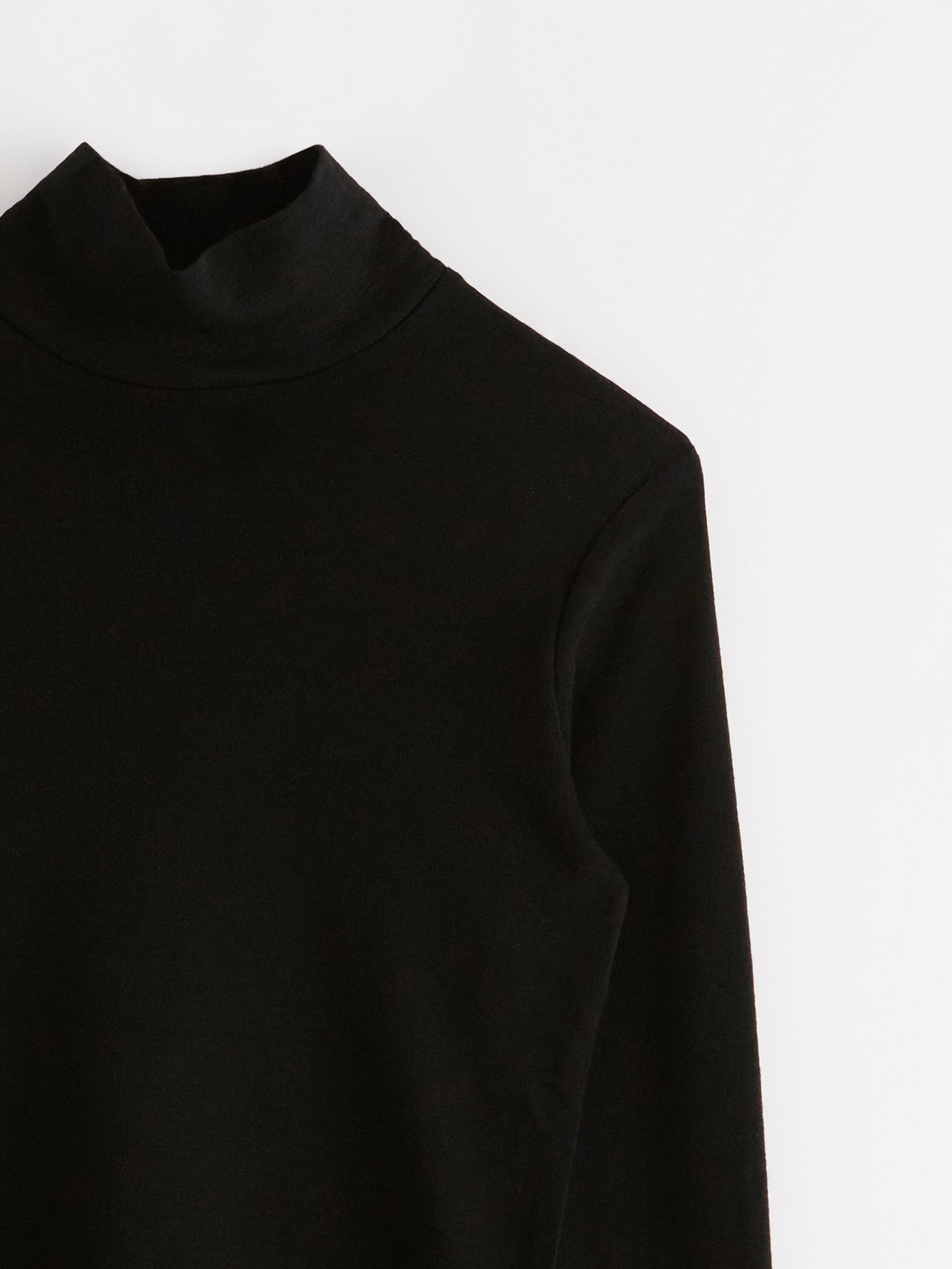 Haut en laine mérinos avec demi-polo noir