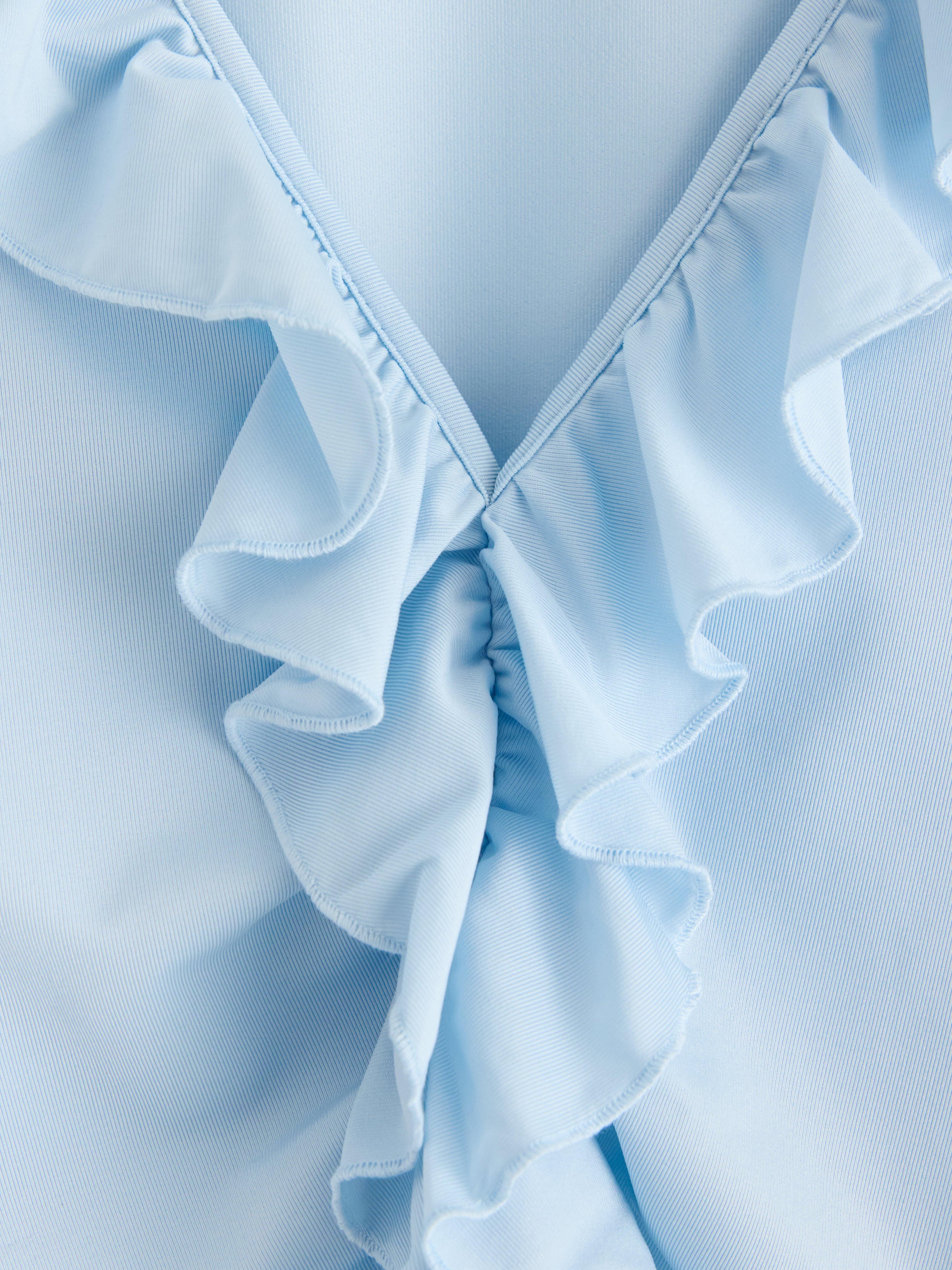 Blusa com babados azul claro