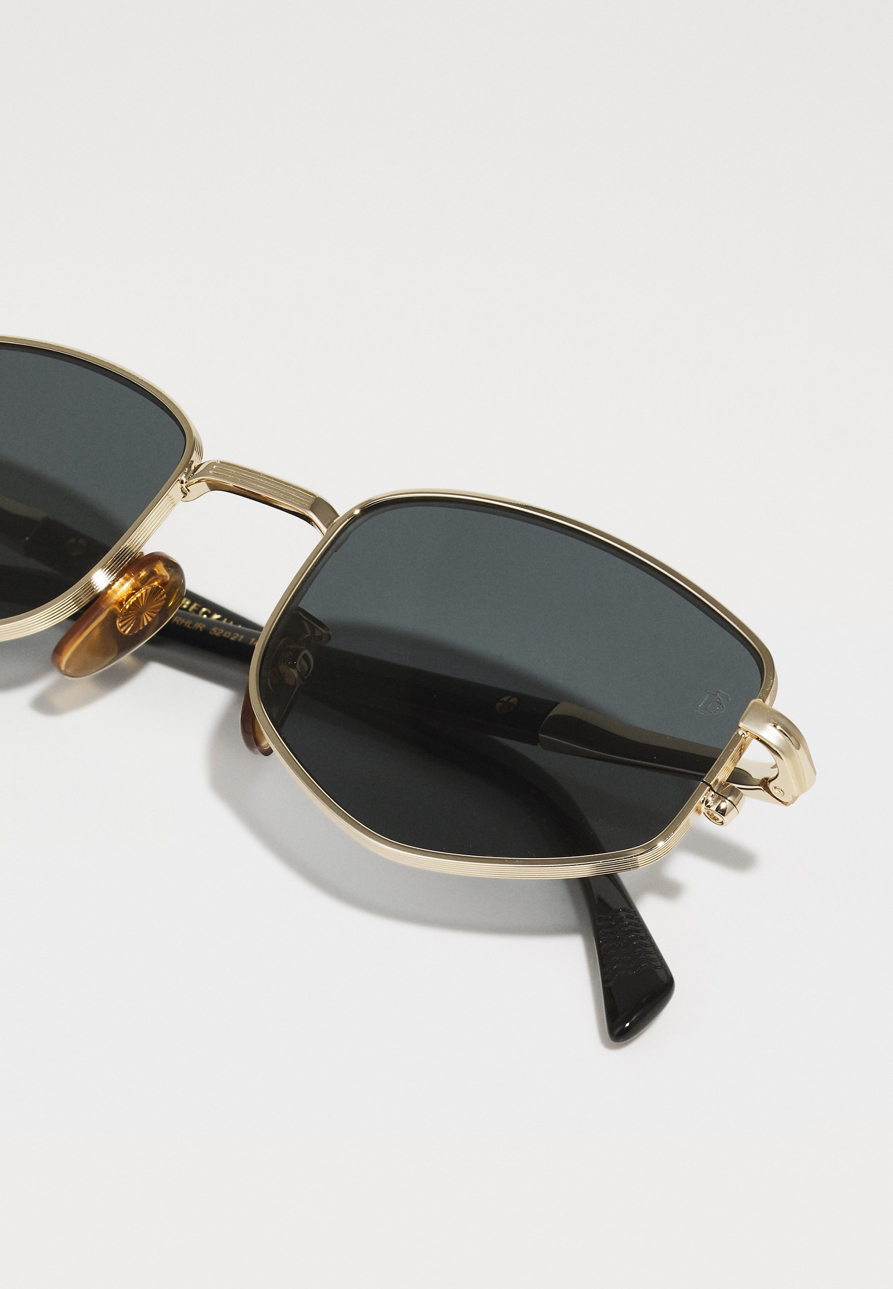 Sonnenbrille von David Beckham – goldfarben/schwarz