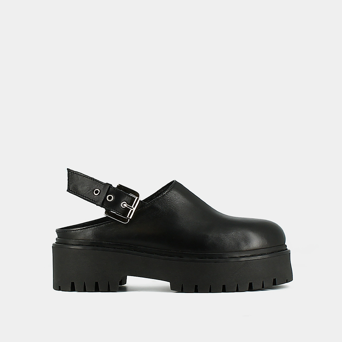 Mules à semelles crantées  en cuir noir