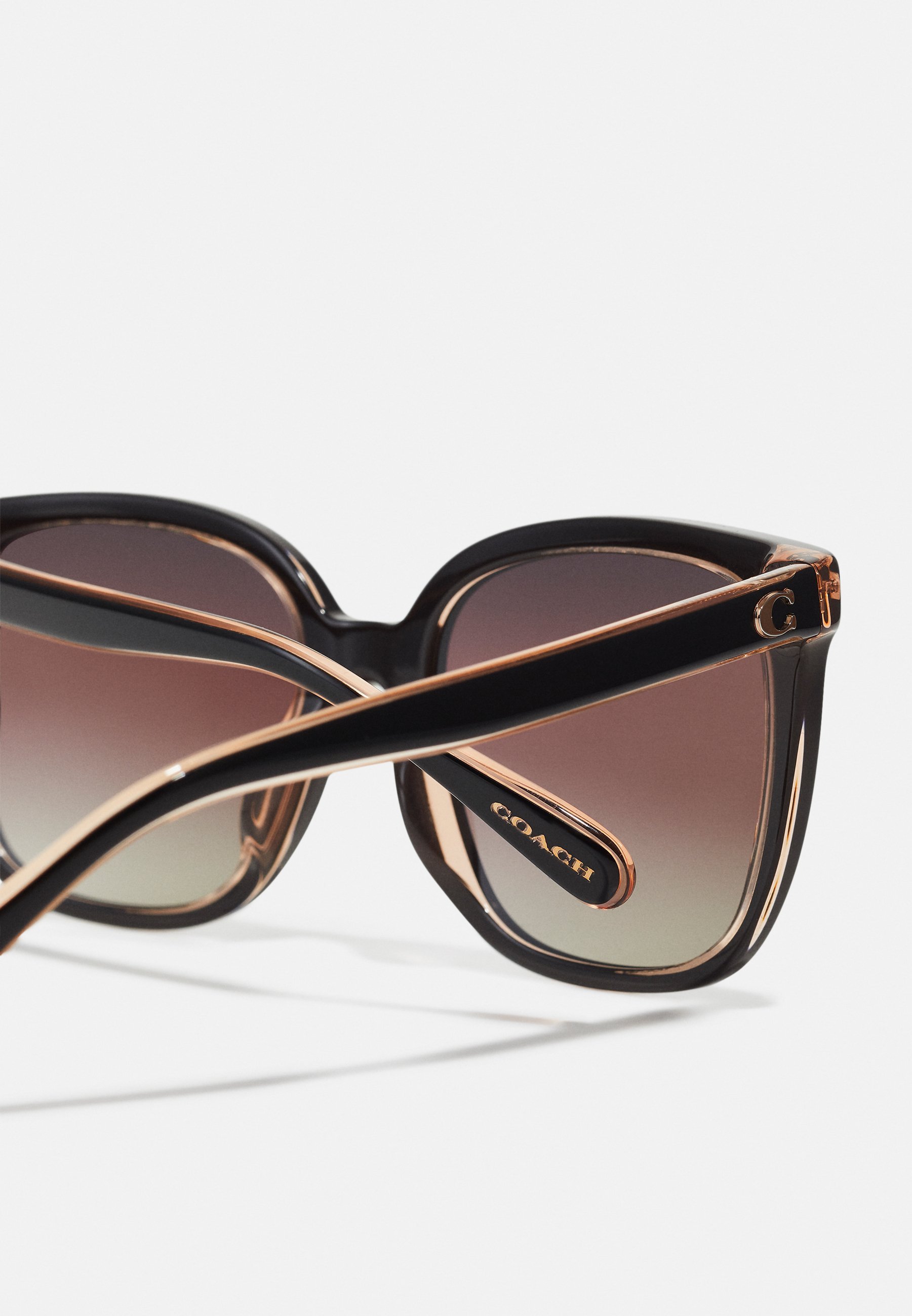 Lunettes de soleil COACH - noir/rose transparent
