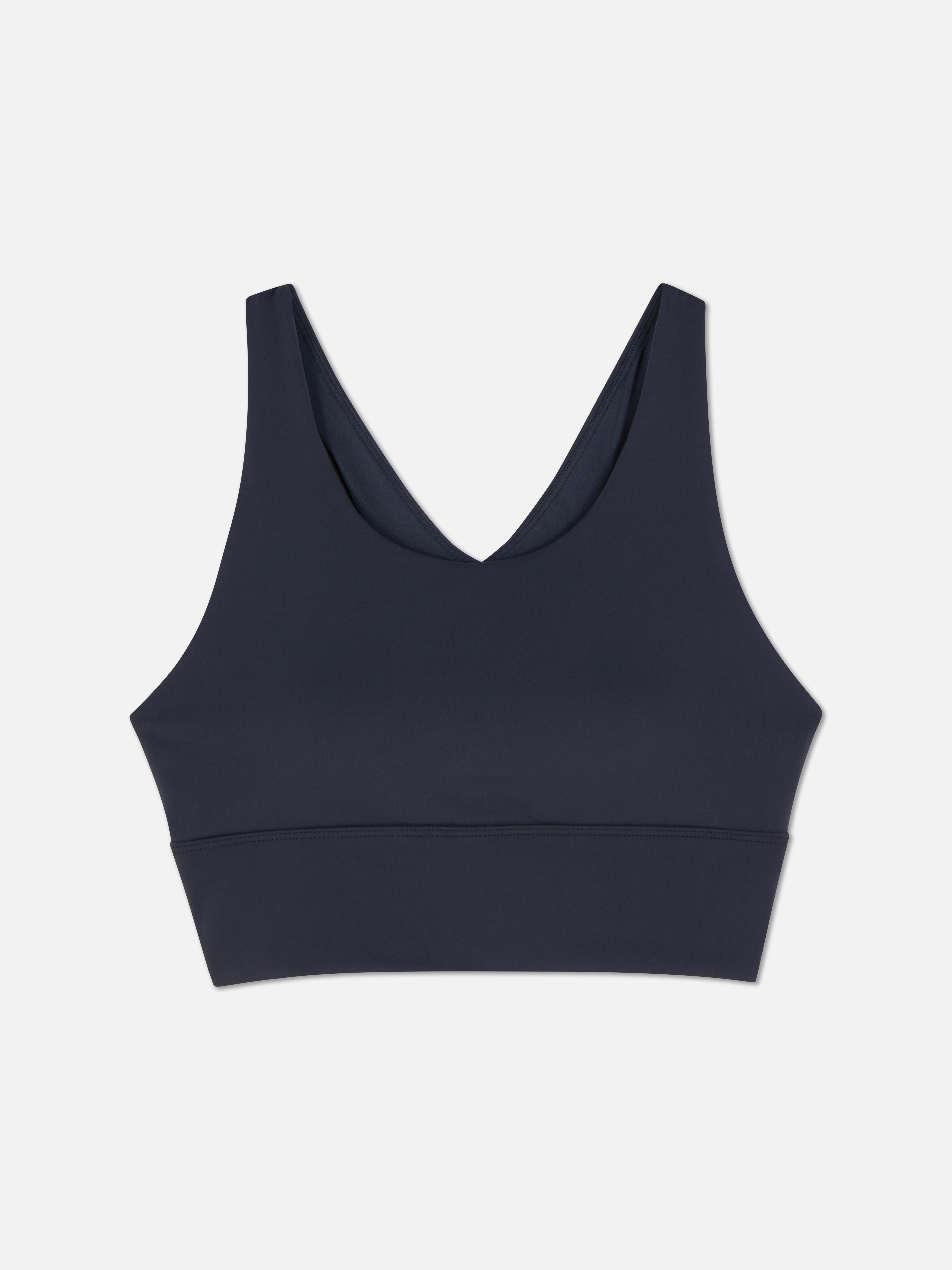 Top scurt, moale, cu imprimeu floral. Un top scurt confortabil și elegant pentru colecția ta sport.