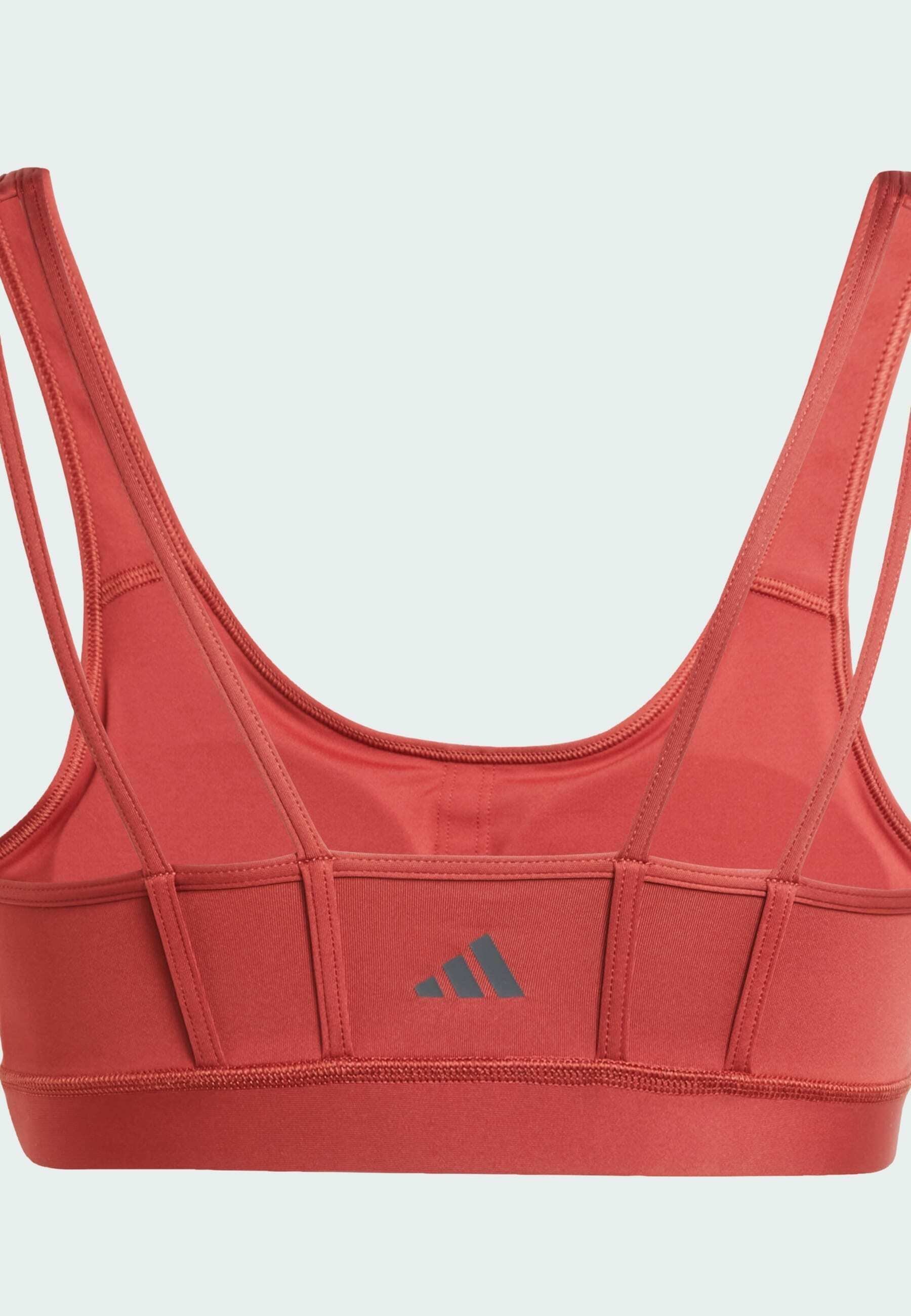 adidas Performance ALL ME ESSENTIALS - Kerget tuge pakkuv spordirinnahoidja - kasutatud rubiinpunane