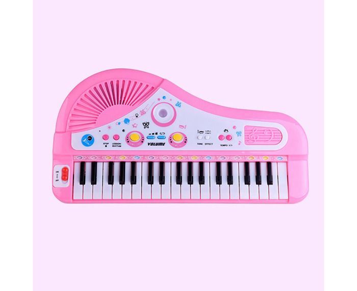 Piano electrónico de 37 teclas con micrófono para niños que aprenden a tocar un instrumento musical.