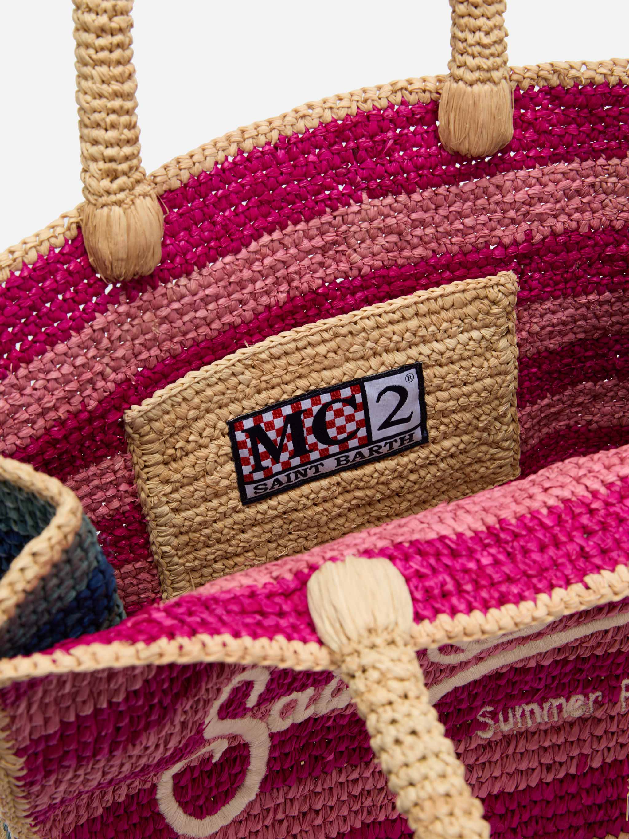 Colette-tas van veelkleurig gestreept raffia met geborduurd logo.
