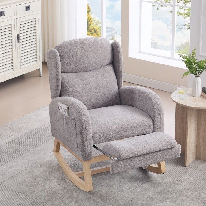 Fauteuil d'allaitement gris à bascule, dossier haut et repose-pieds réglable avec poche. Confortable pour salon et chambre.