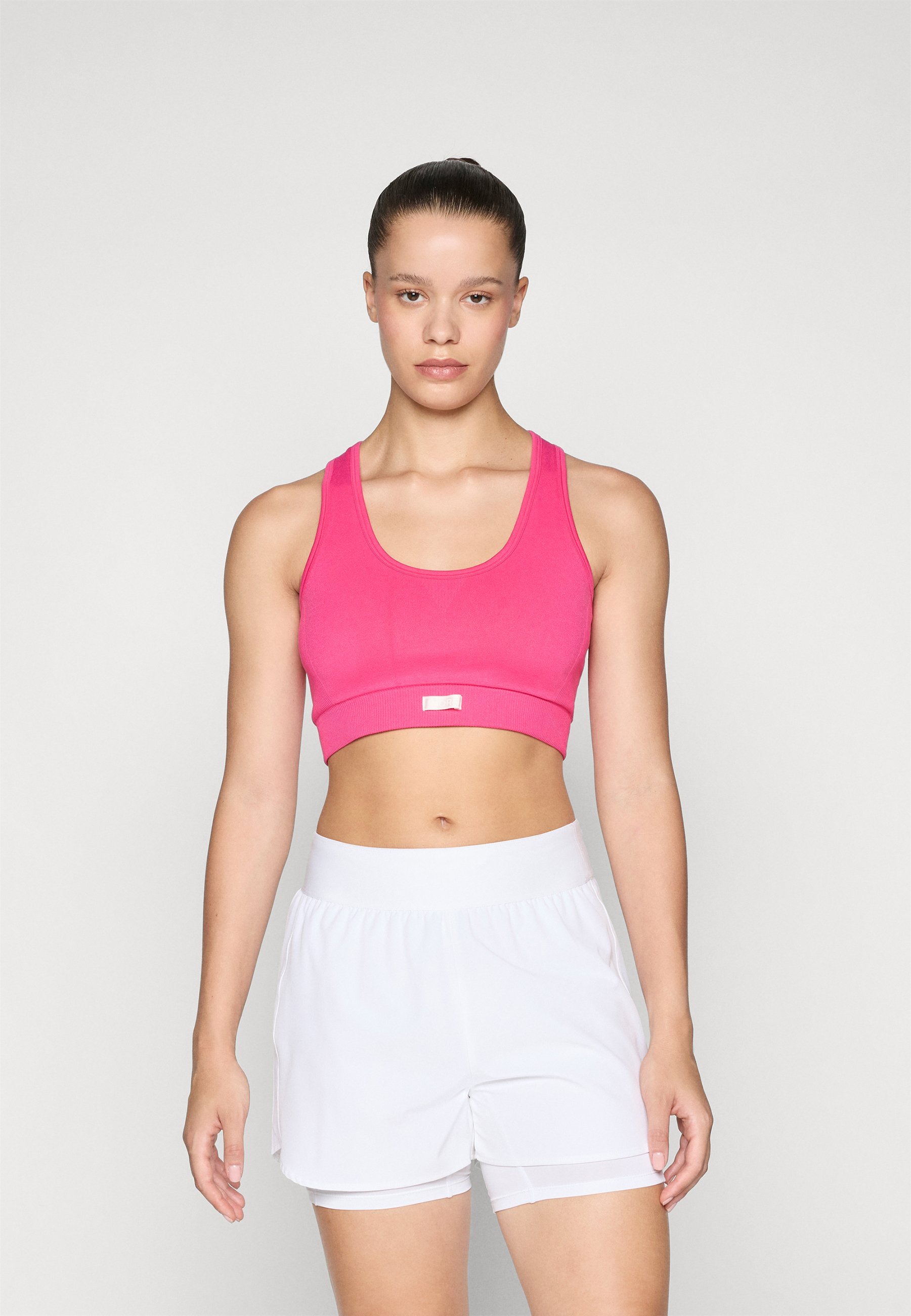 Sutiã esportivo Björn Borg STUDIO SEAMLESS LOW - Suporte leve - rosa brilhante