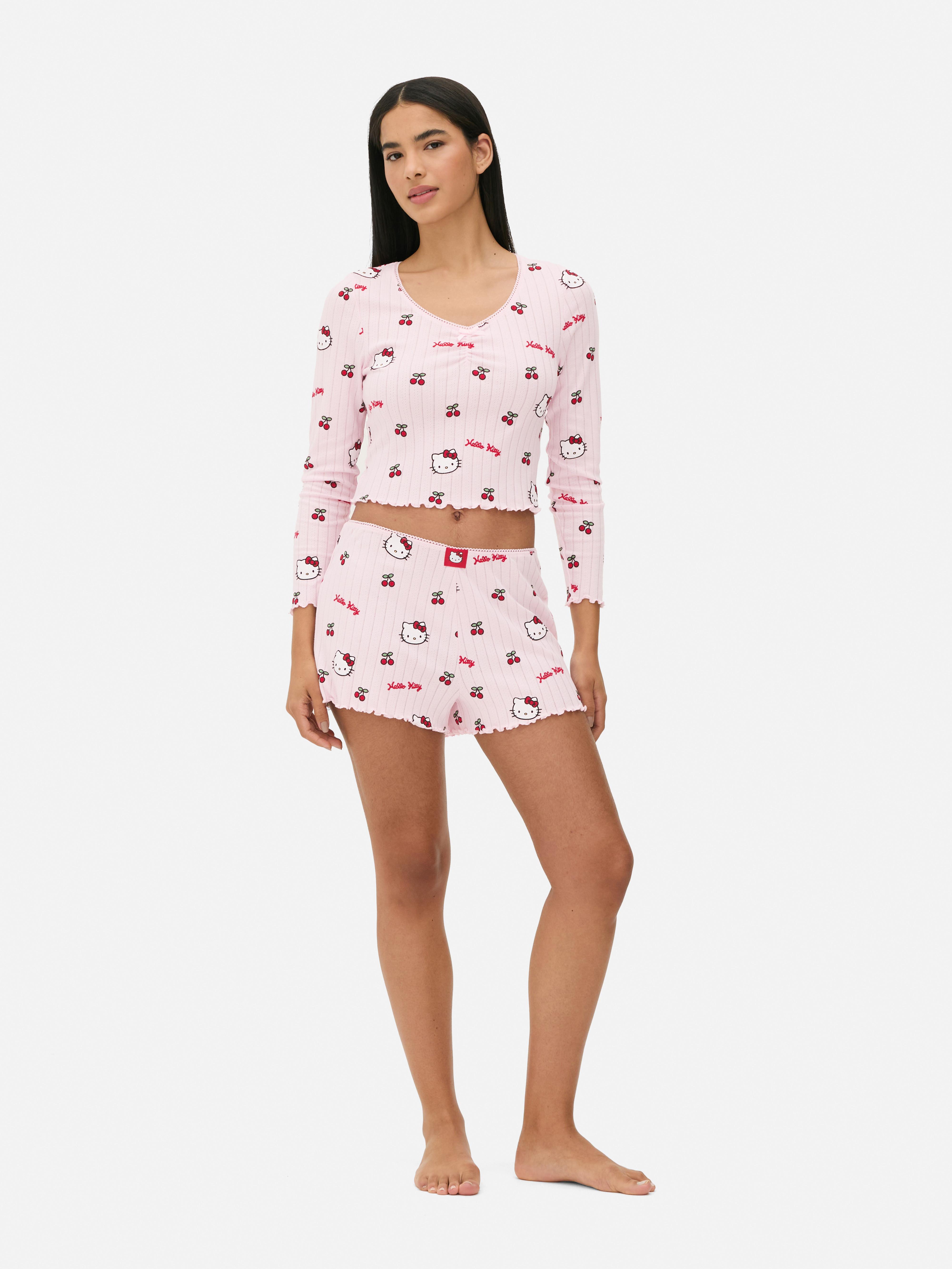 Top de pijama cu mânecă lungă și imprimeu Hello Kitty ajurat Un top de pijama Hello Kitty cu mâneci lungi, ajurat, garnitură picot și tiv festonat