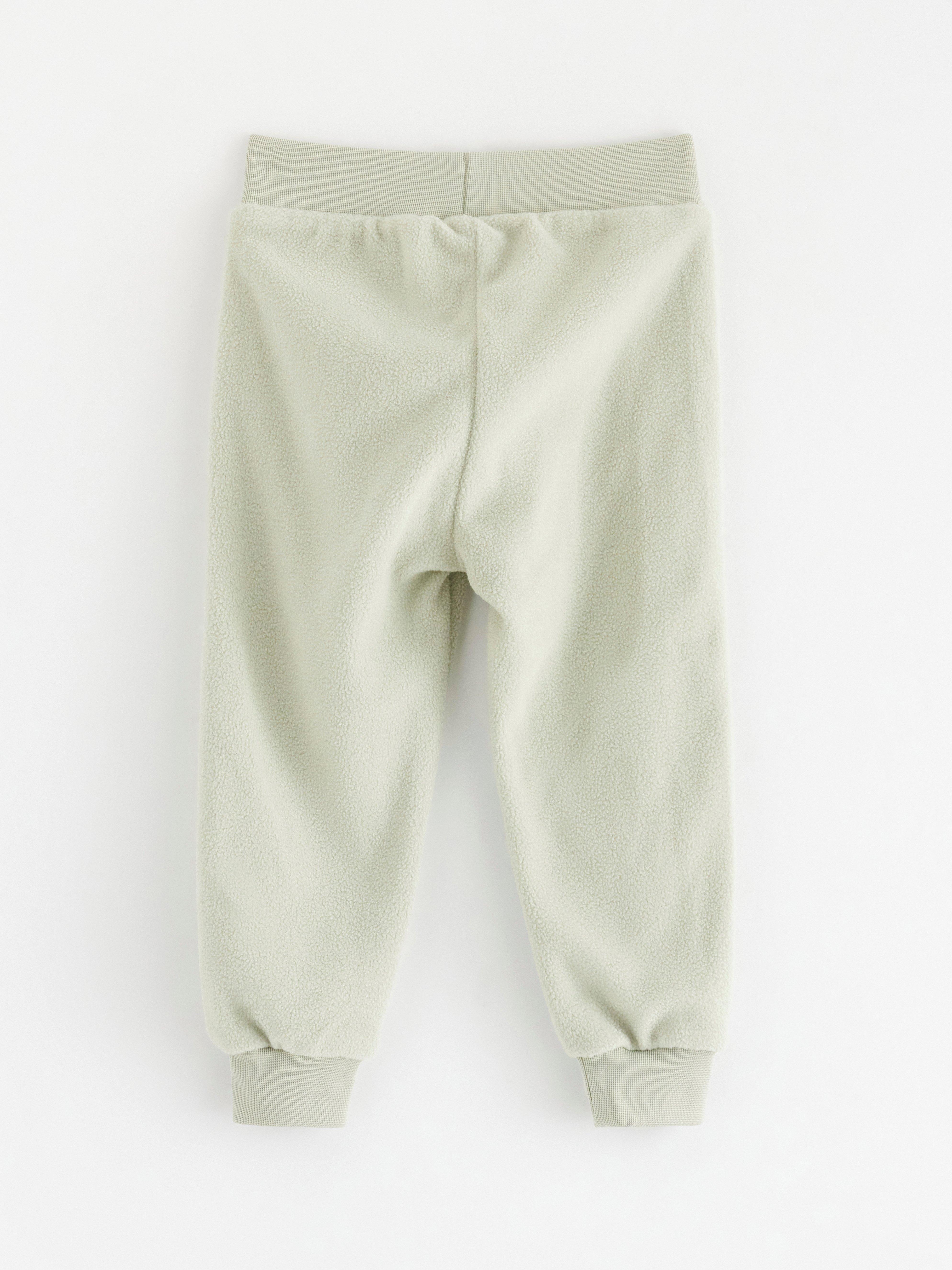 Calça de moletom fleece verde claro acinzentado