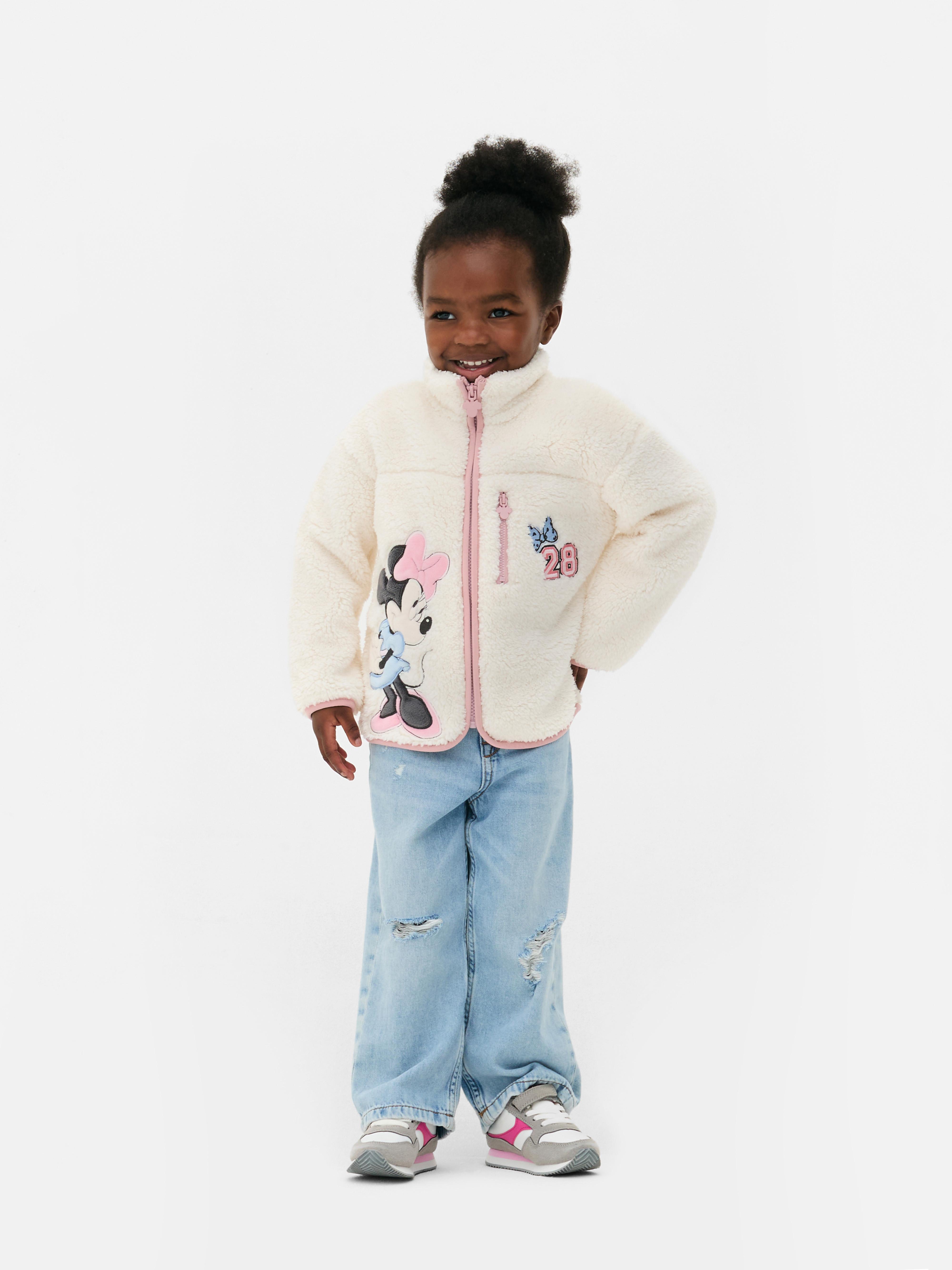 Hanorac din fleece Disney Minnie Mouse Un hanorac din fleece cu guler ridicat, fermoar, buzunar la piept și garnitură contrastantă