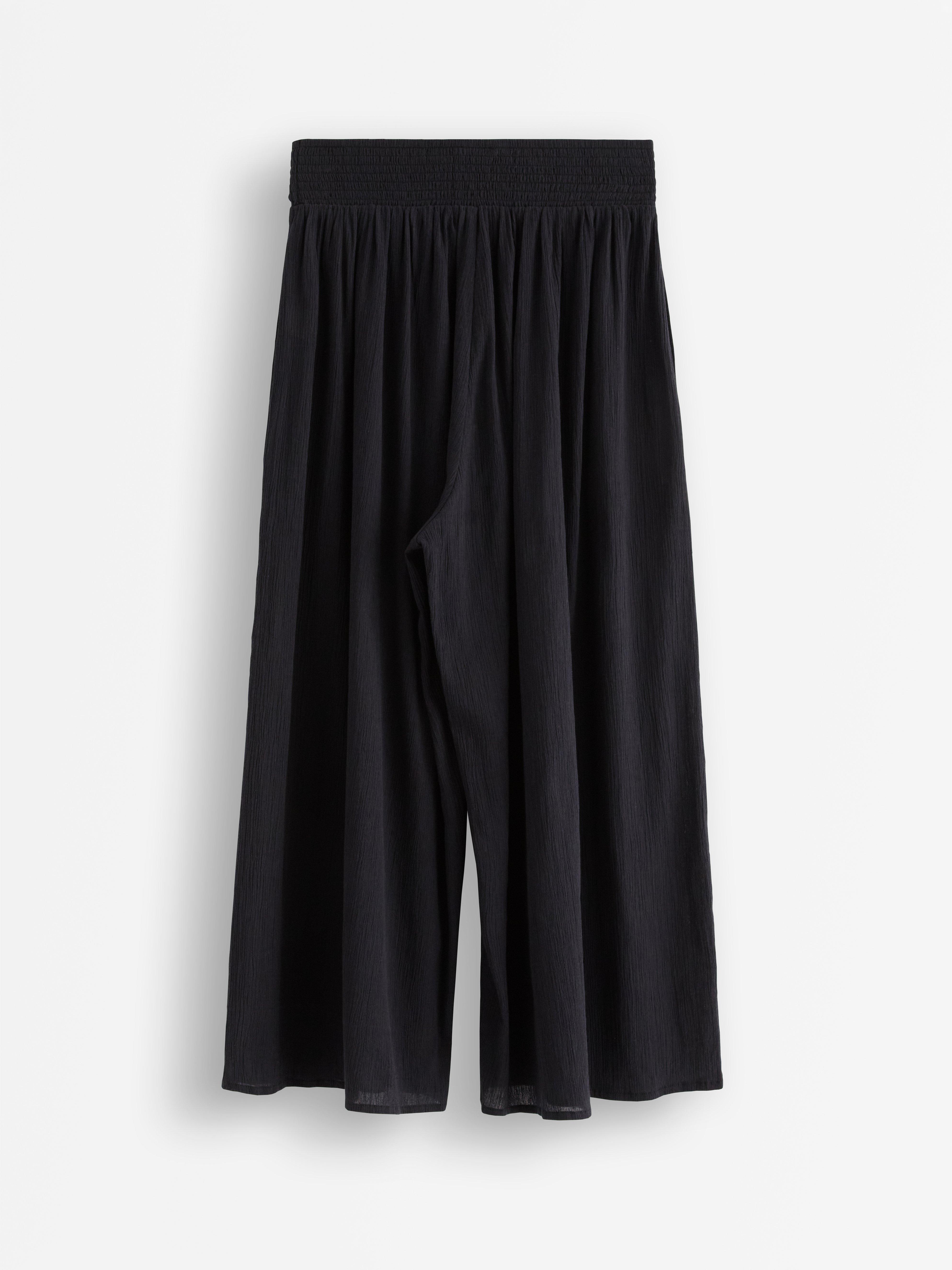 Pantalones anchos tobilleros negros