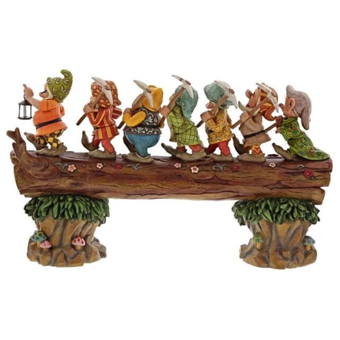 Seven dwarf trees decorate the garden, a miniature resin statue of a dwarf.