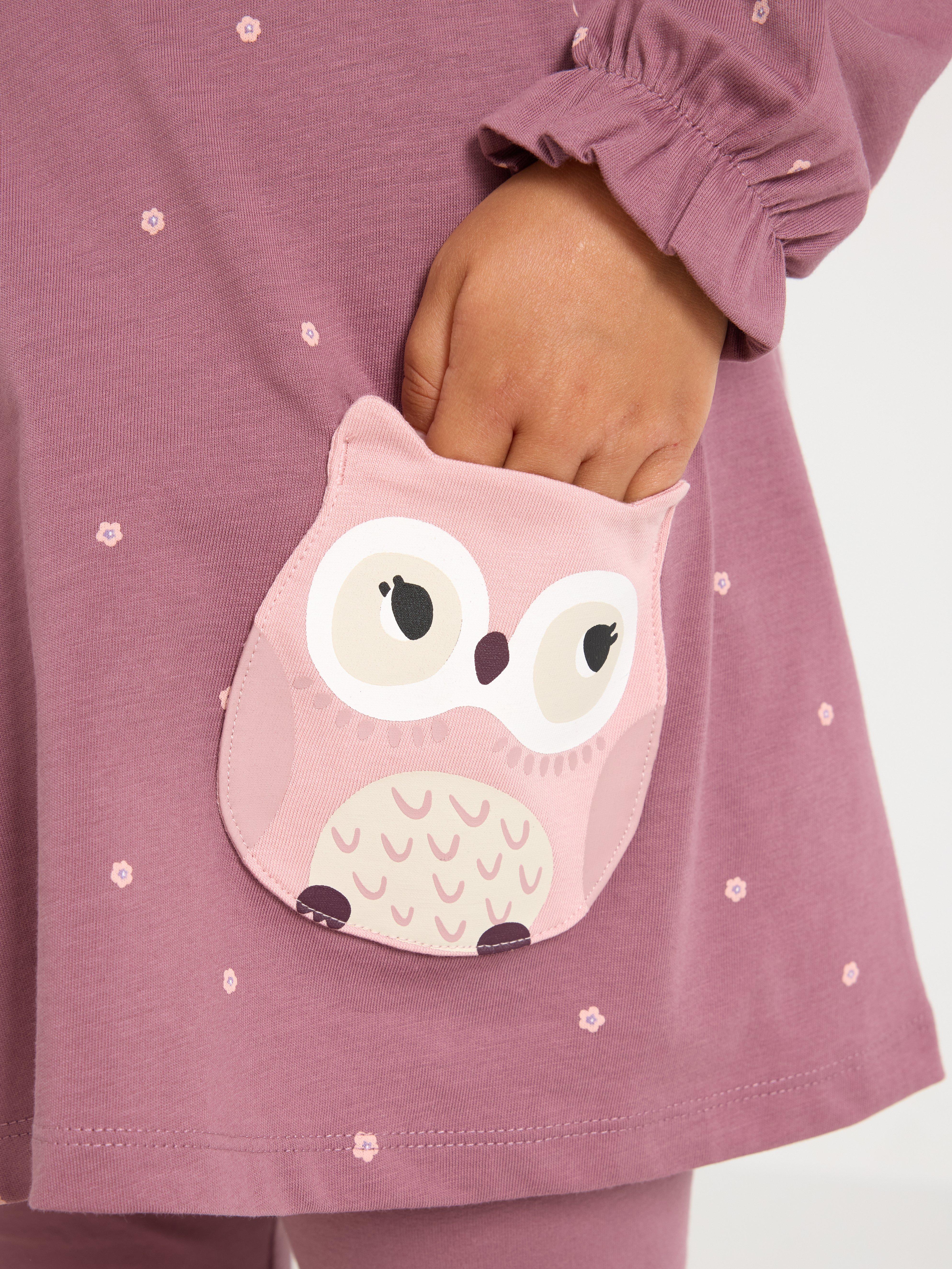 Túnica de manga comprida com bolsos divertidos na cor lilás acinzentado.