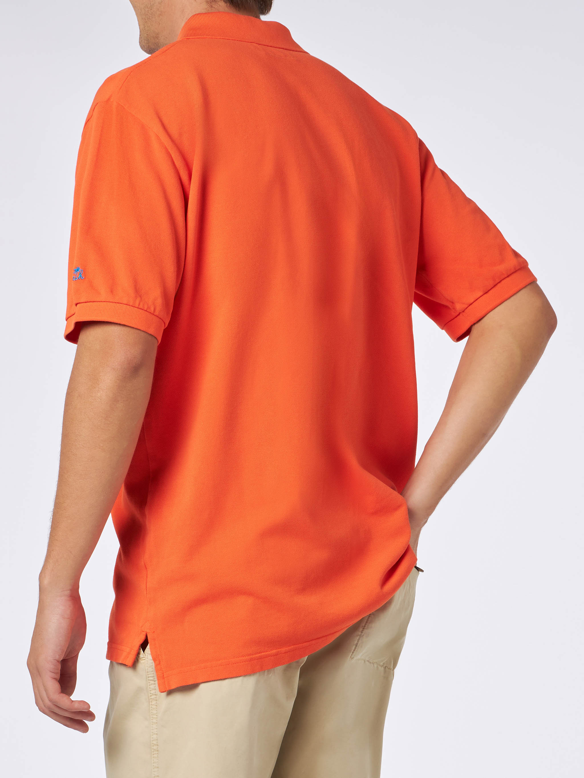 Polo de piqué naranja para hombre con logo de St. Barth y efecto vintage.