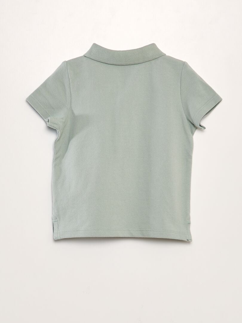 Polo shirt van katoenpiqué met palmbomenprint - GROEN
