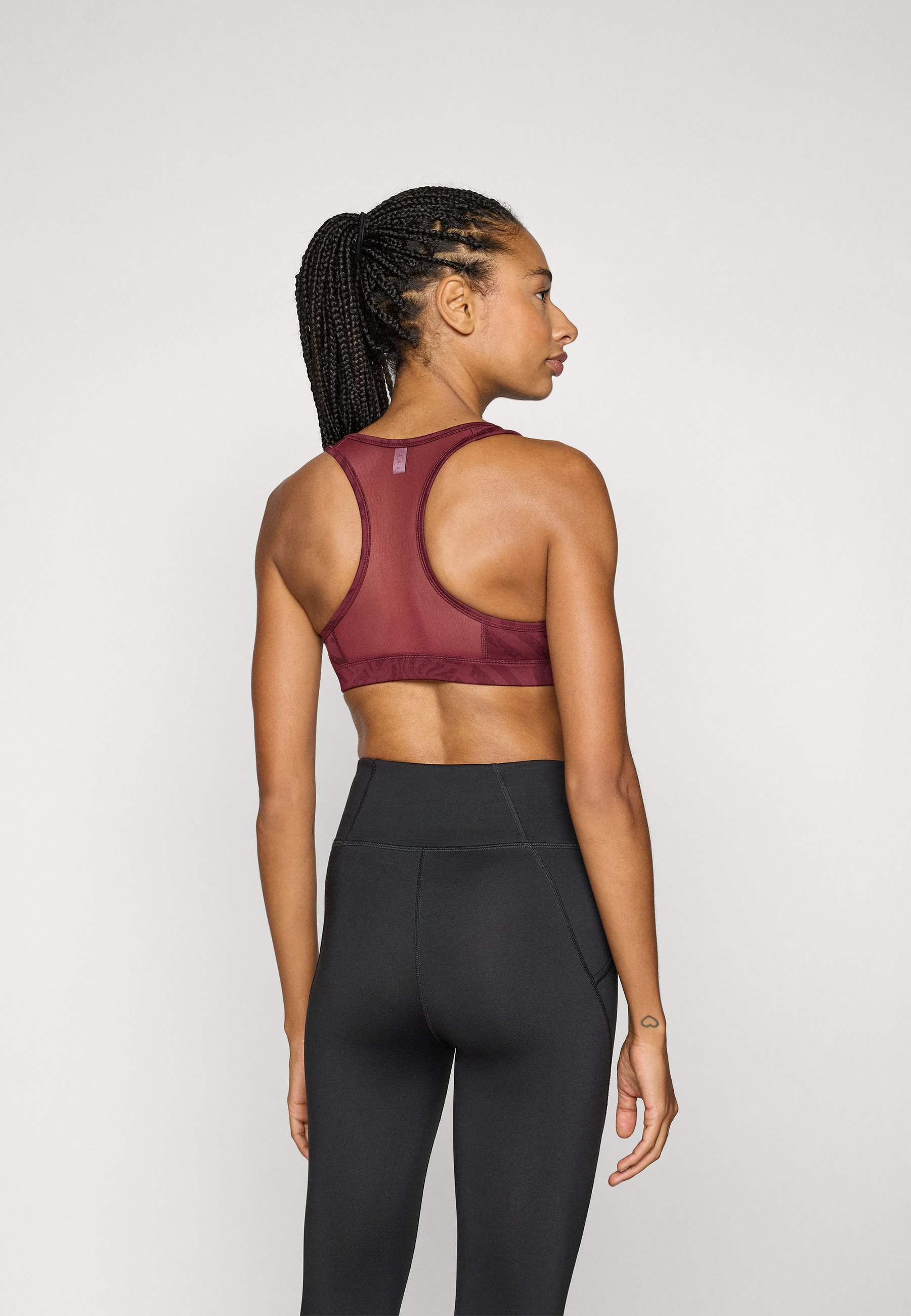 Soutien-gorge de sport Puma à rayures et rembourrage - Maintien moyen - effet rubis scintillant