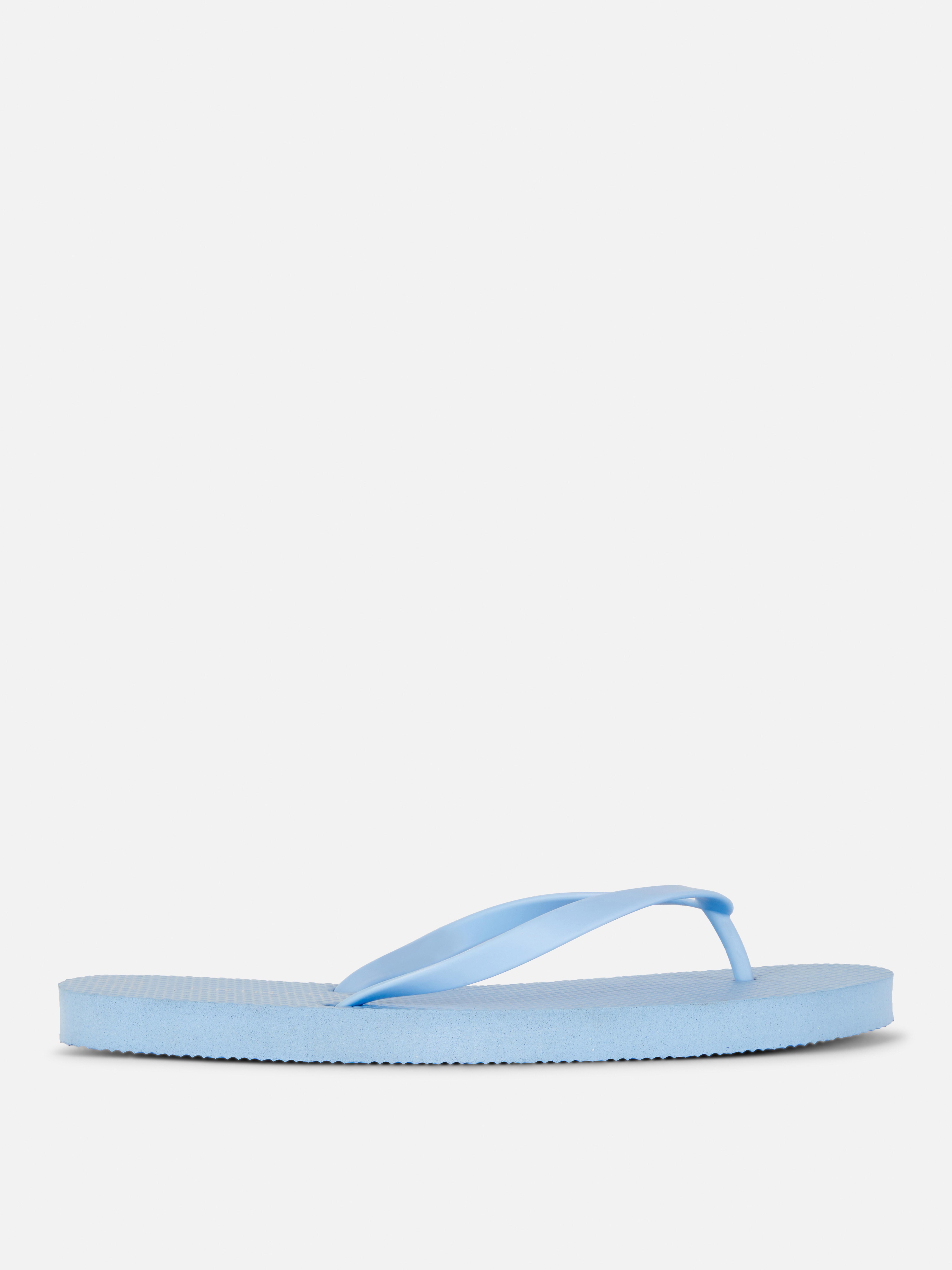 Flip-flops clasici O pereche de flip-flops simpli cu barete înguste și talpă plată