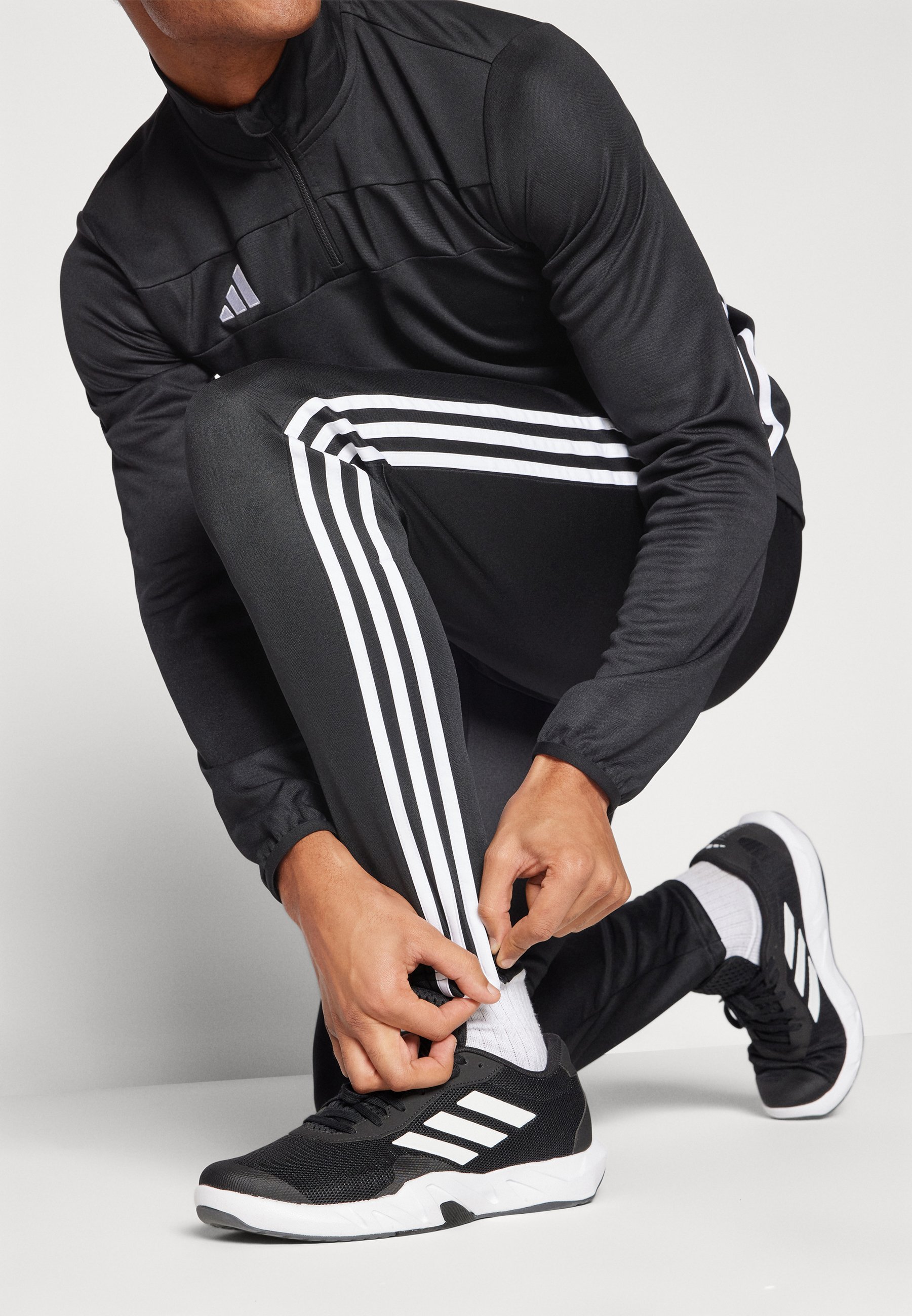 adidas Performance TIRO 25 ESSENTIALS - Bas de survêtement - Noir/Blanc