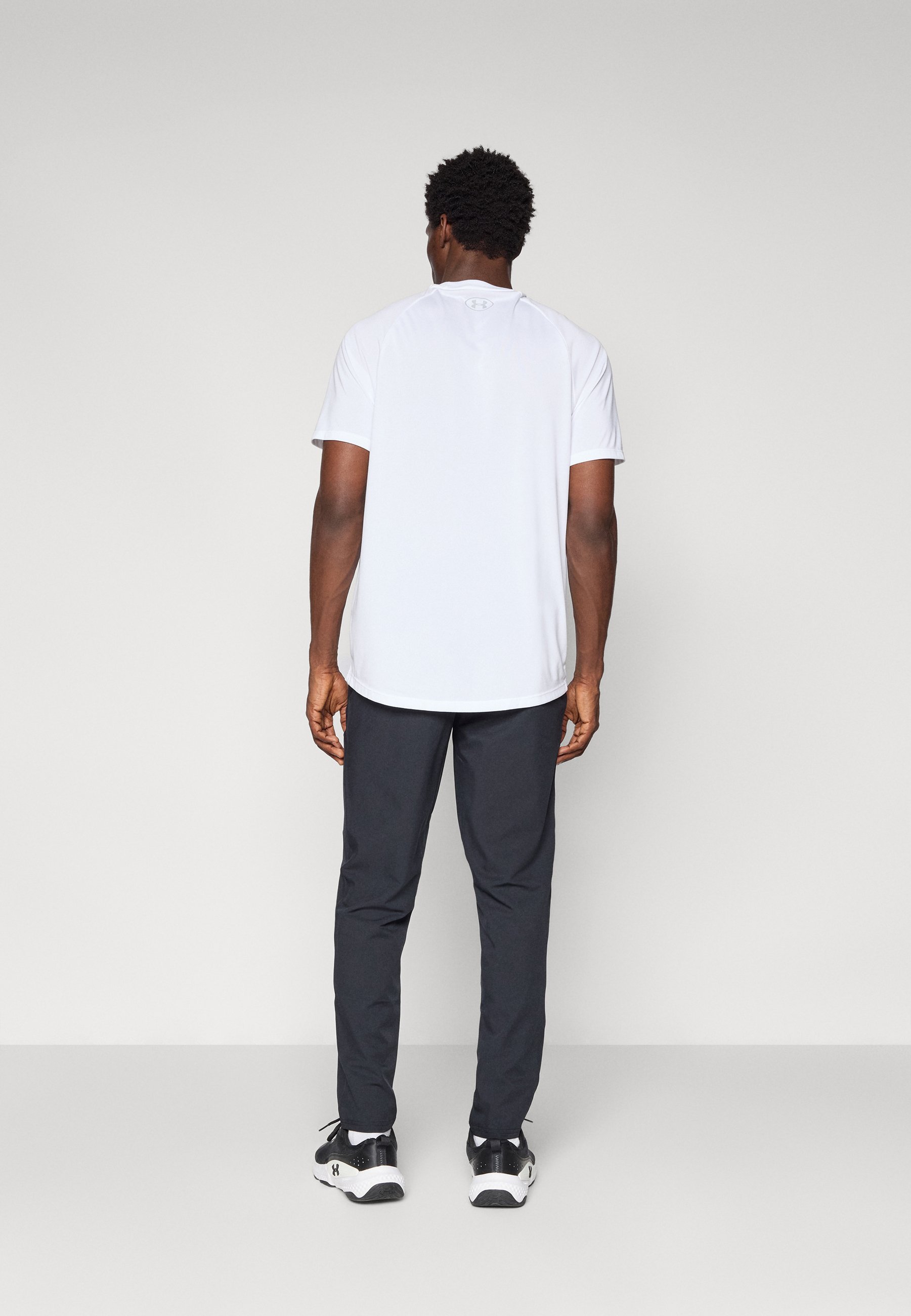 Pantalon de survêtement Under Armour UNSTOPPABLE TAPERED - Noir