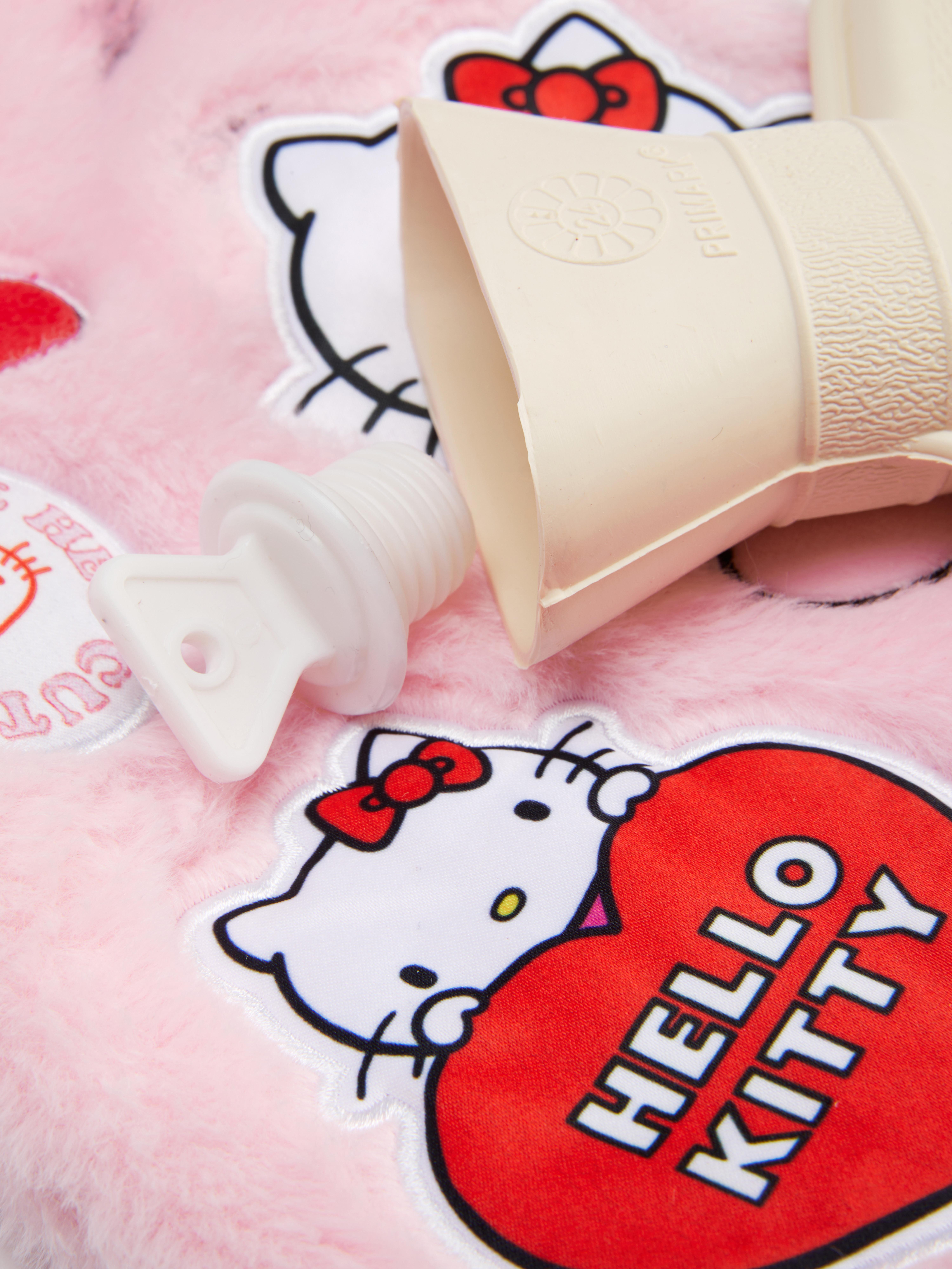 Sticla cu apă caldă Hello Kitty O sticlă cu apă caldă cu o husă moale Hello Kitty și detalii aplicate