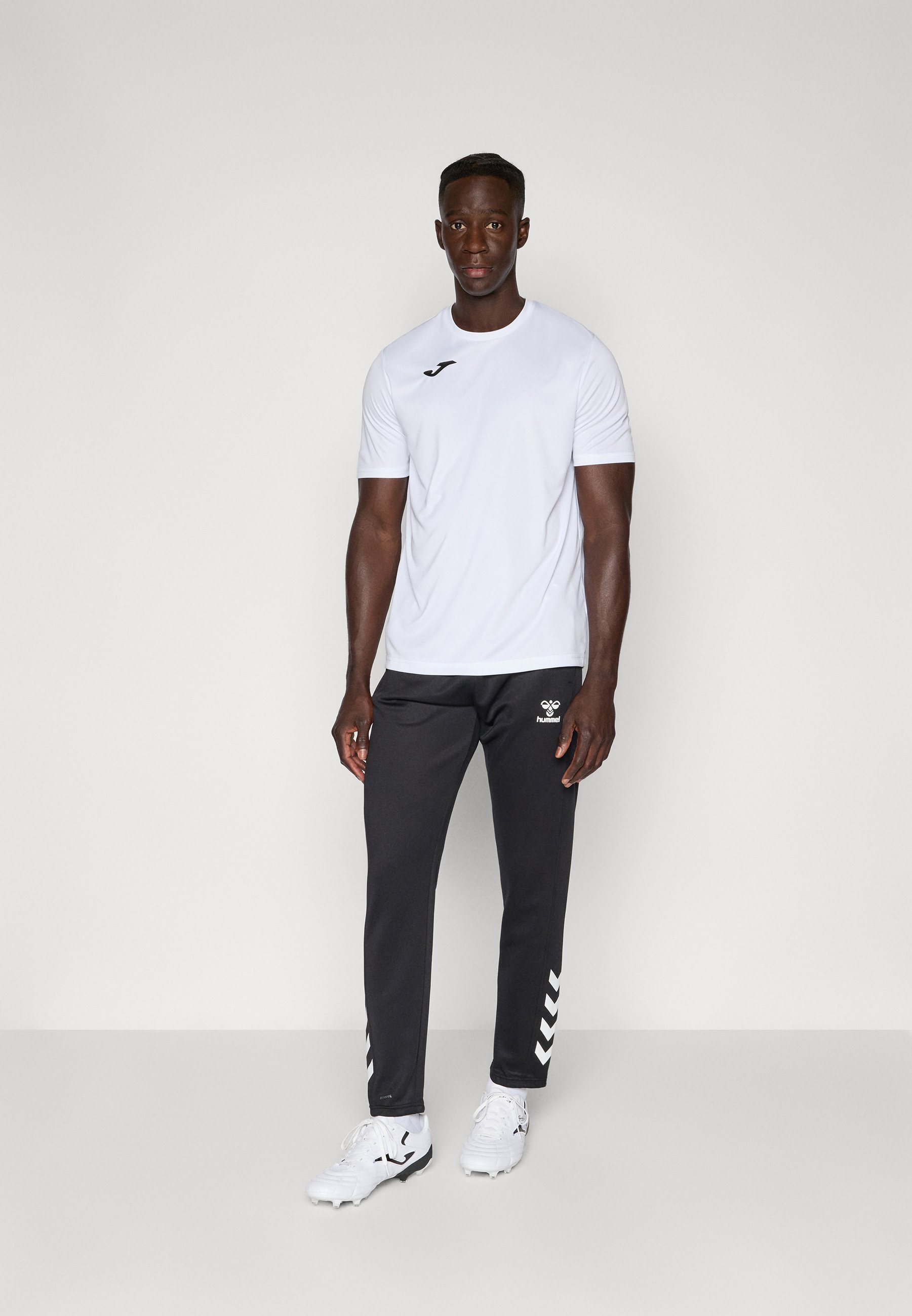 Hummel HMLCORE PANTS - Trainingsbroek - zwart