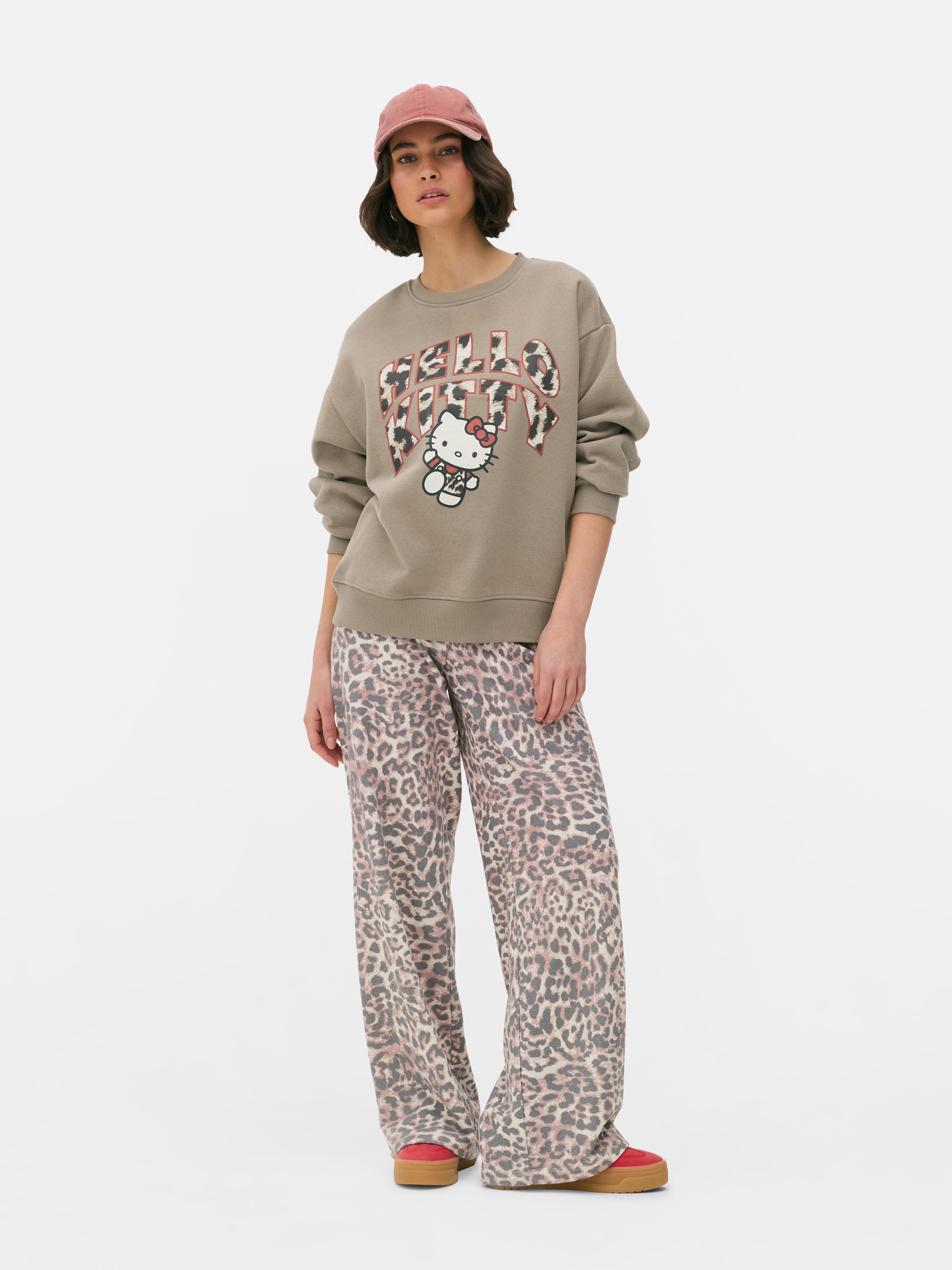 Φούτερ Hello Kitty με λεοπάρ λογότυπο. Συνδυάσαμε την Hello Kitty με λεοπάρ στάμπα. Παρακαλώ.