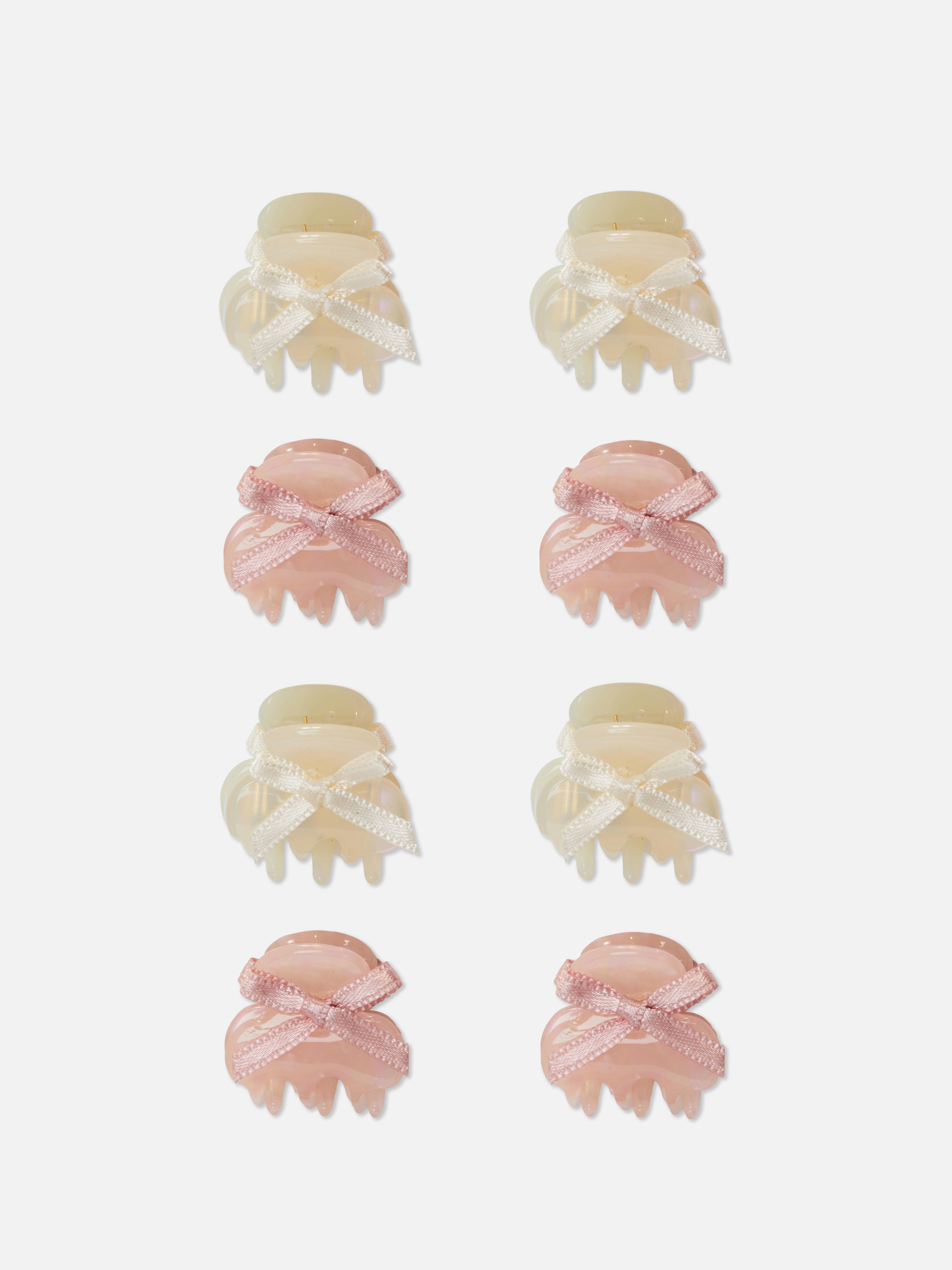 Mini Bulldog-hårspenner med sløyfer, sett med 8. En multipakke med mini Bulldog-hårspenner med sløyfer på toppen.