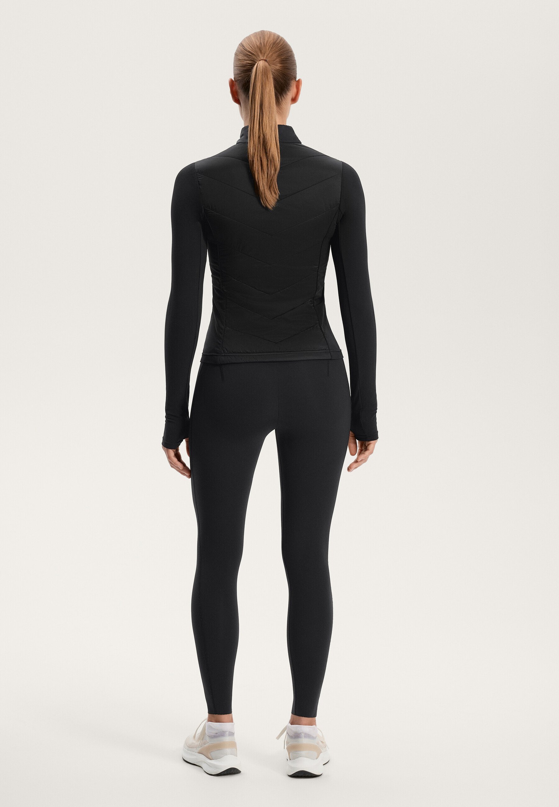 OYSHO VOLCANIC - Veste de running - noire
