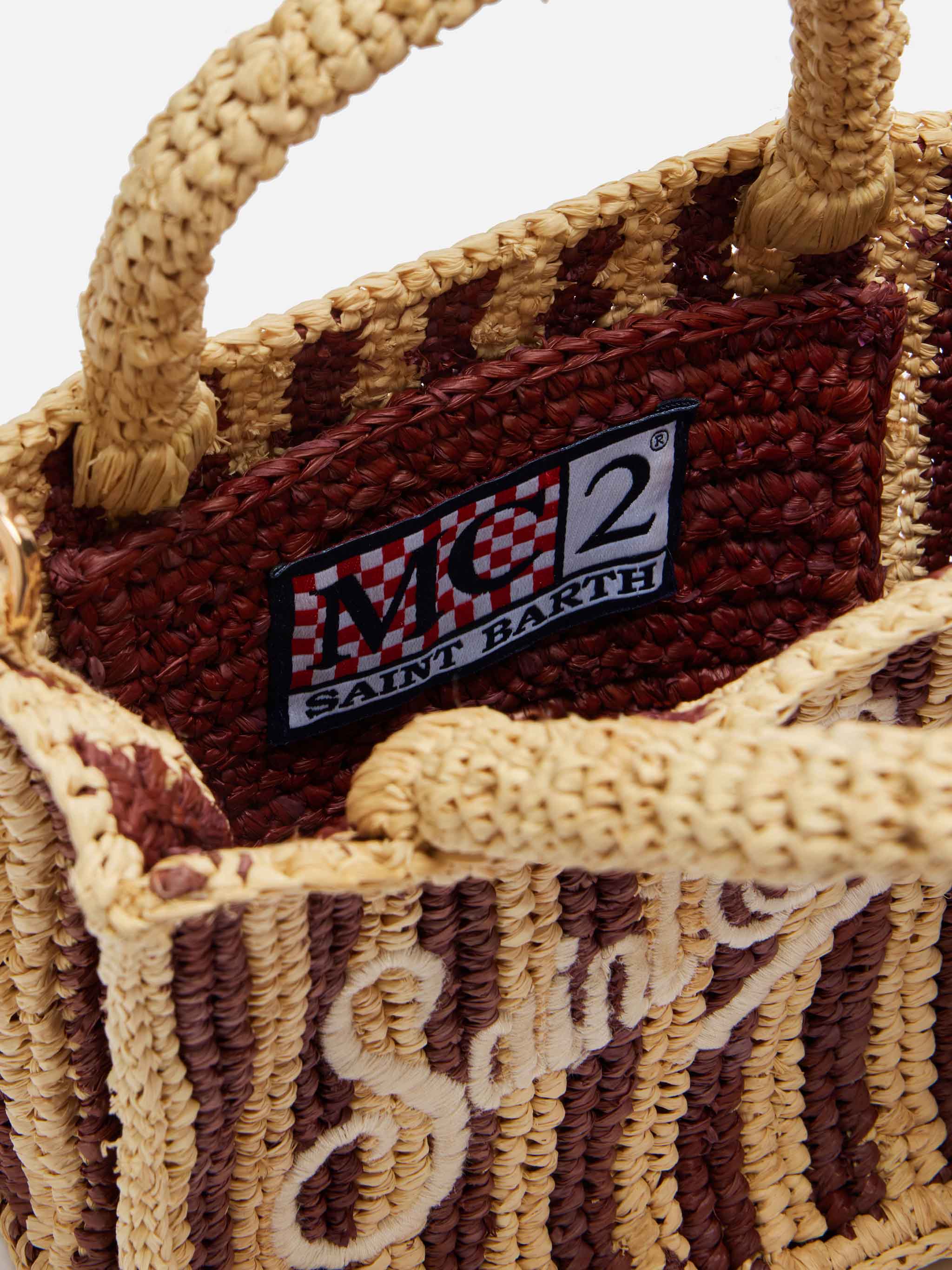 Mini toilettasje van raffia met gestreepte print
