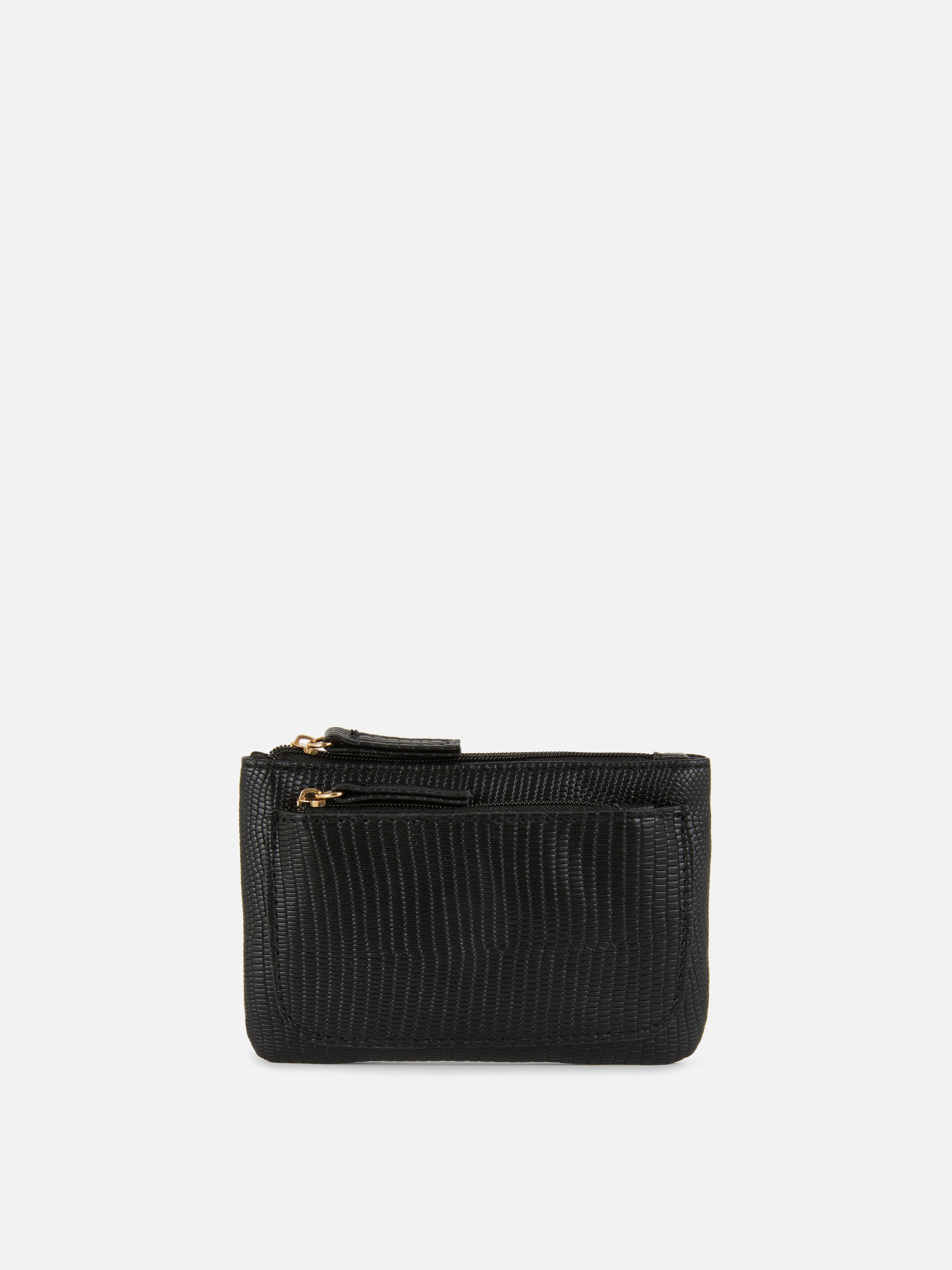 Handtasche in Schlangenoptik. Modische und funktionelle Handtasche mit Reißverschluss, strukturierter Oberfläche und mehreren Fächern.