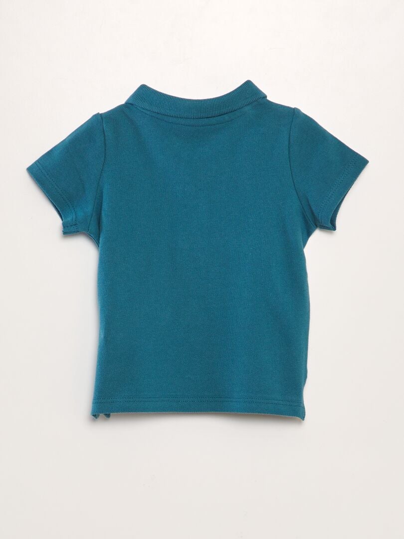 Polo de algodão piqué com estampa de palmeiras - AZUL