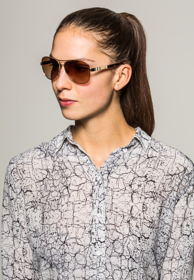 Lunettes de soleil Burberry - or