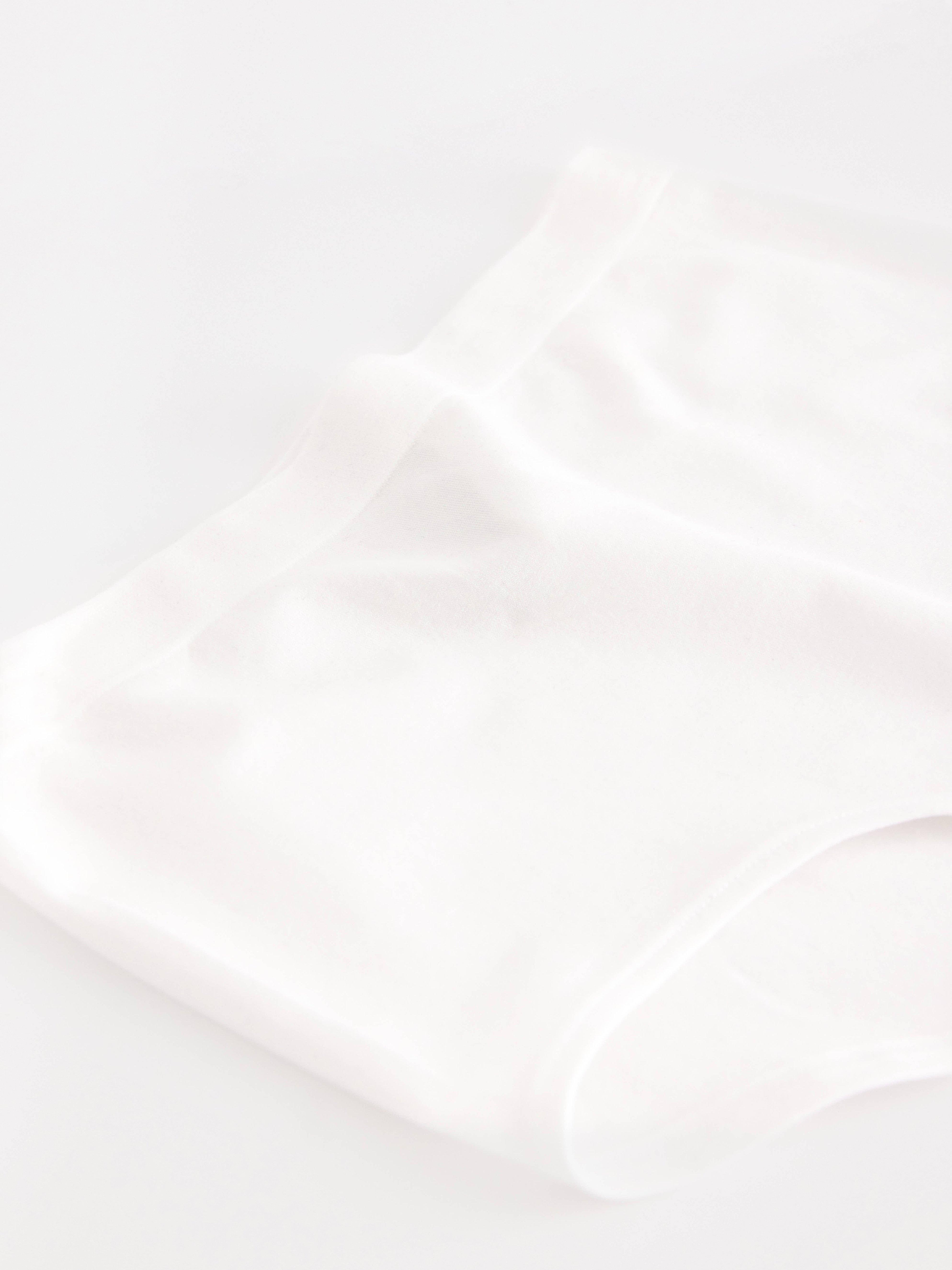 Pantalón blanco de talle alto sin costuras