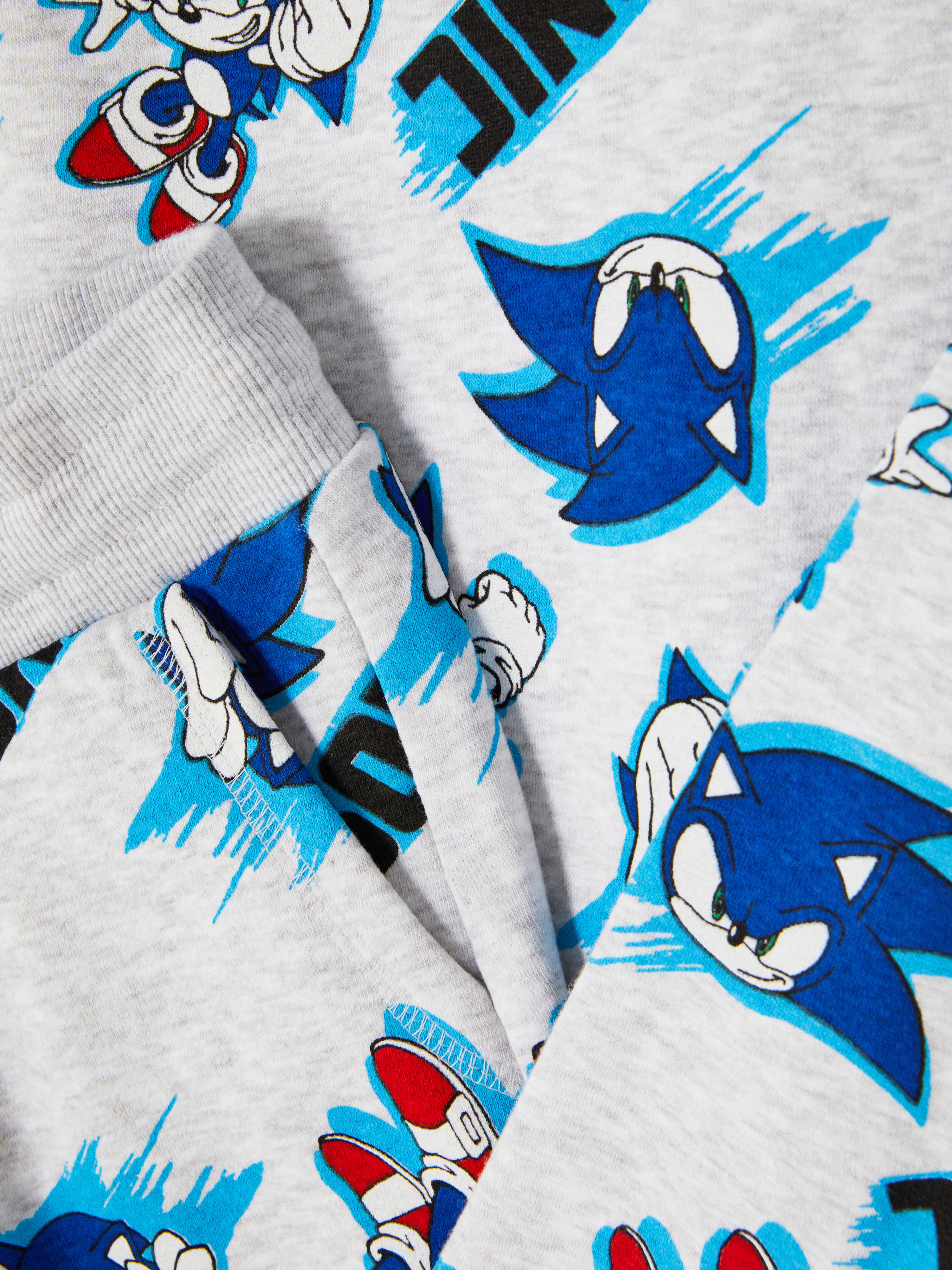 Felpa e pantaloni della tuta di Sonic the Hedgehog. Un set di Sonic the Hedgehog con felpa e pantaloni della tuta abbinati.