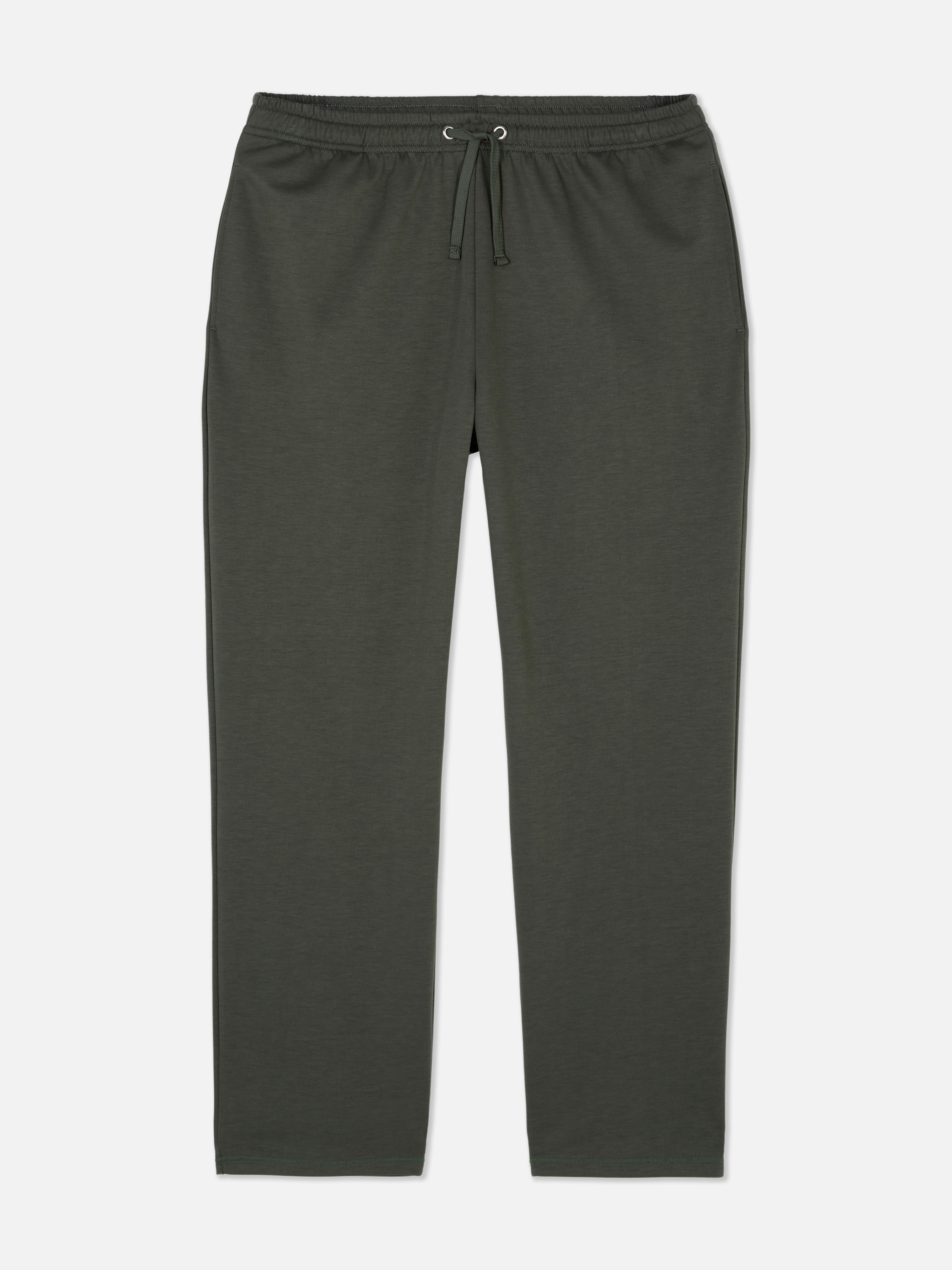 Pantaloni de pijama din jerseu. Acești pantaloni de pijama cu aspect de casă au o închidere reglabilă cu șnur.