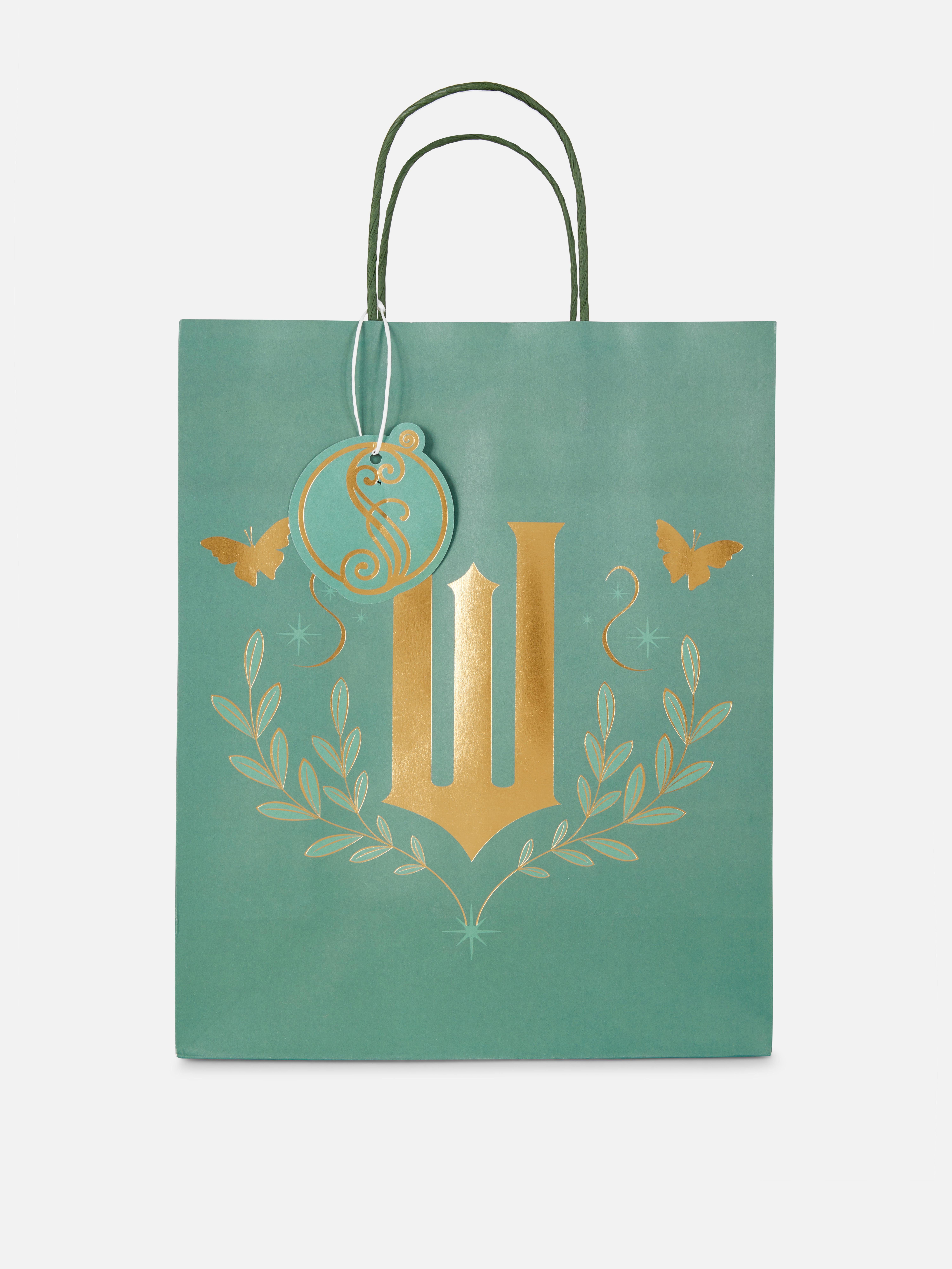 Geantă cadou Wicked x Primark cu logo O geantă cadou Wicked cu etichetă cadou, logo și mânere de transport