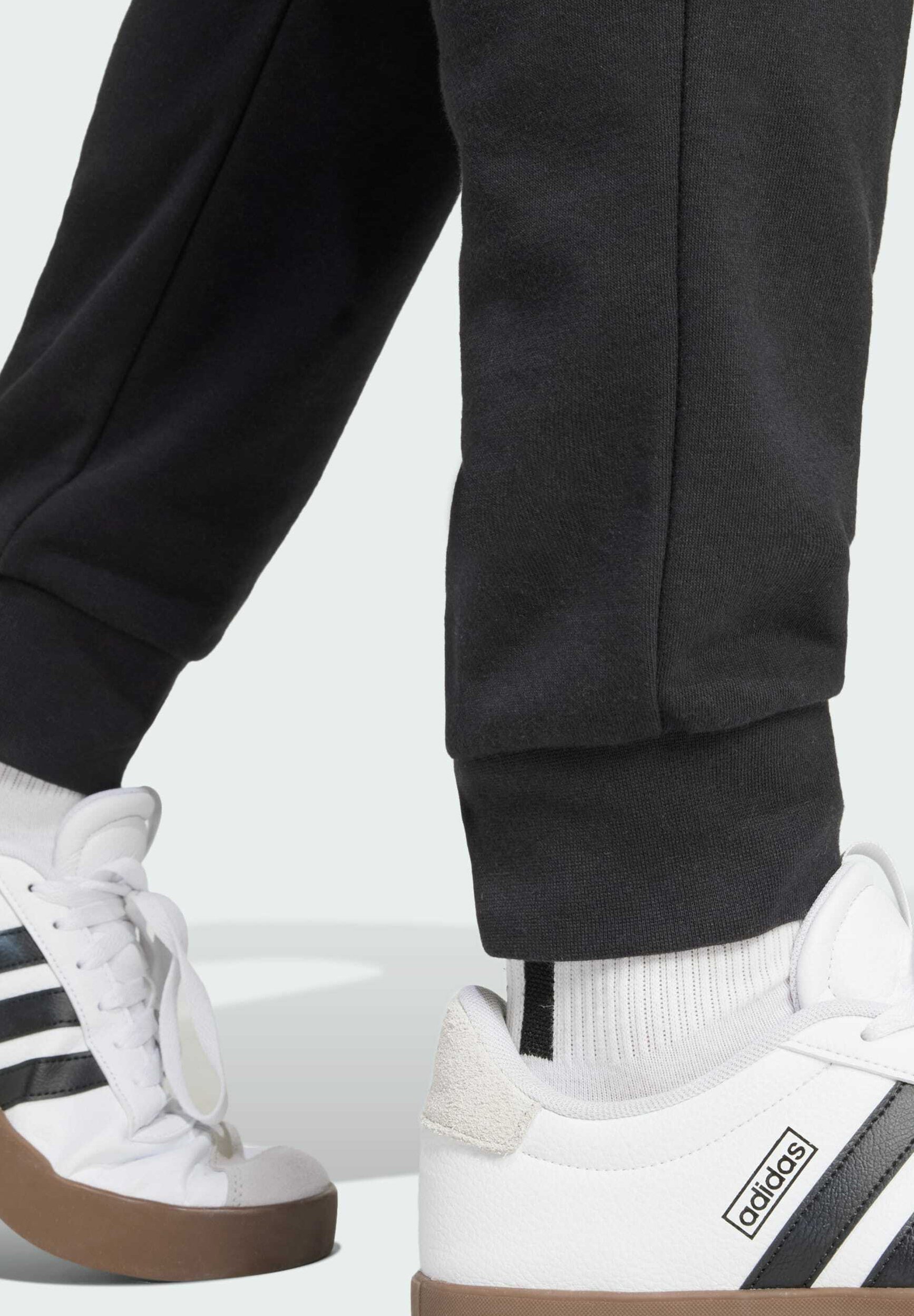 adidas Sportswear ESSENTIALS FEEL COZY - Spodnie dresowe - czarno-białe